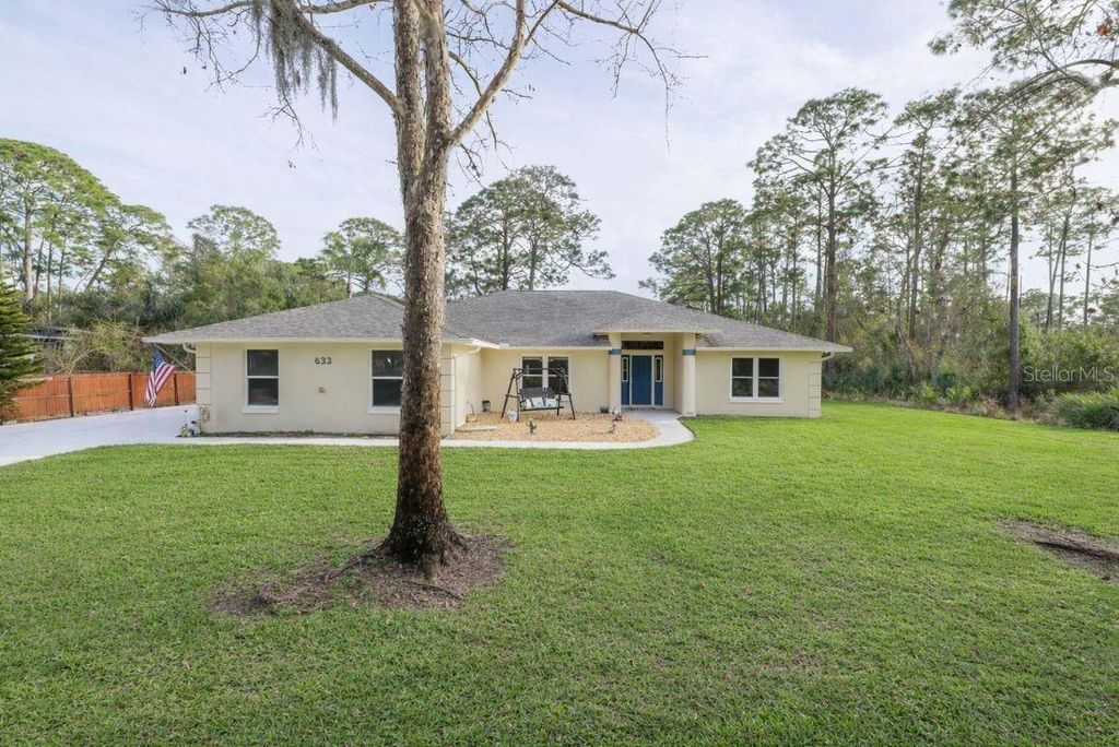 Photo of 633 Art Center Avenue, New Smyrna Beach, FL 32168 (MLS # FC316711)