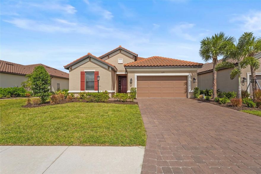 Welcome to your dream home in the highly desirable, gated community of Esplanade at The Heights! This beautifully upgraded Azzurro floor plan offers nearly 1,900 square feet of thoughtfully designed living space. With 2 bedrooms, 2 bathrooms, and a versatile den, this home effortlessly blends style, comfort, and modern functionality. Step inside to discover an elegant interior adorned with crown molding and a spacious, open-concept layout. The chef-inspired kitchen is the heart of the home, featuring GE stainless steel appliances, a gas stove, gleaming quartz countertops paired with a tile backsplash, a generous island, and a large walk-in pantry—perfect for entertaining or everyday living. The split-bedroom layout ensures privacy, while the luxurious primary suite offers a tranquil retreat with a walk-in shower, dual vanities, a linen closet, and a shared walk-in closet. The den provides flexible space ideal for a home office, hobby room, or potential third bedroom. This home has been thoughtfully enhanced with new landscaping, a screened lanai overlooking a private preserve, and a sealed paver driveway. Additional features include garage overhead storage racks, a large laundry room with a new washer and dryer, and a modern 2023 build that supports today’s lifestyle. Step outside and enjoy the tranquility of your backyard or embrace the resort-style living that Esplanade is known for. Community amenities include a sparkling pool and spa, cabana area, firepit, state-of-the-art fitness center, and lighted tennis, pickleball, and bocce courts. A dedicated Lifestyle Manager curates engaging events and social gatherings year-round. For those who enjoy the outdoors, the community also features a pet-friendly park, scenic hiking trails, and wide-open green spaces—providing the perfect backdrop for fitness, recreation, or simply soaking in Florida’s natural beauty. Perfectly situated near State Road 70 and University Parkway, you’re just minutes from premier shopping, dining, outdoor recreation, and the stunning beaches of Florida’s west coast. Don’t miss this incredible opportunity to own a piece of paradise in Esplanade and make this exceptional home yours.