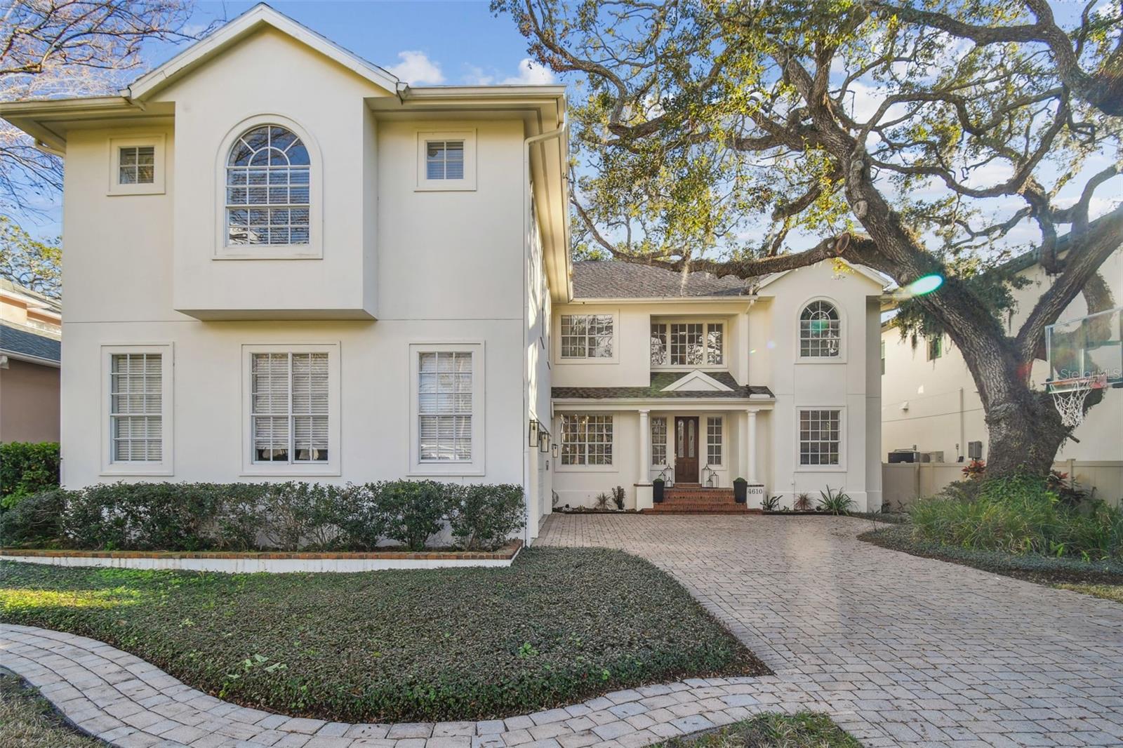 PRICE REDUCTION...The possibilities at endless at 4610 W Browning Ave, a beautiful 5-bedroom, 5.5-bathroom residence nestled in the heart of South Tampa's Sunset Park neighborhood. Built in 1999 and partially remodeled in 2021, this expansive 4,485 square-foot home offers a harmonious blend of classic elegance and modern amenities. Upon entering the home, you will be flanked by a spacious home office, featuring a wood-burning fireplace, and a large formal dining room. Walk through the foyer to a large family room, kitchen and dining area. The renovated kitchen features a large island with quartz waterfall countertops, high end appliances along with a built-in wine refrigerator. The adjacent family room is a wonderful space for hosting family and friends and is connected to a beautifully functional butler’s pantry, perfect for entertaining. French doors from the family room lead to a covered back porch with room for grilling while looking over the backyard and pool area. Enjoy Florida's beautiful weather as you envision your private backyard oasis, complete with a covered patio and spacious pool area. Upstairs, the spacious owner's suite is highlighted by a gas fireplace, his and her closets, and a spa-like master bath, finished in beautifully honed marble, featuring a glass enclosed shower, freestanding tub, and separate custom vanities. The second bedroom includes an en-suite bathroom, the third bedroom has in own bath across the hall, and the fourth and fifth bedroom share an extended Jack-n-Jill bath. All upstairs baths feature quartz countertops, chrome fixtures, and lighting. The 5th bedroom above the garage may also be used as a large bonus room. Located in a highly sought-after South Tampa neighborhood, this home offers convenient access to Plant District schools, upscale shopping, fine dining, and vibrant cultural attractions. Don't miss the chance to make this remarkable property yours. Schedule a private showing today and experience the wonderful lifestyle that awaits you at 4610 W Browning Ave.