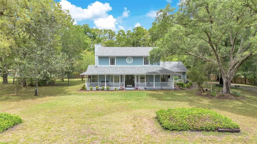 Most people settle for a house. You've been looking for something different. 211 Spring Hollow Blvd sits on two acres surrounded by the canopy shade of mature trees, the kind of property that makes you exhale the moment you pull in. Wrap-around porch. Saltwater pool. A 30x24 garage that actually fits your life. RV pad with 30-amp hookups. Two acres zoned for horses. Room for the dogs, the toys, the gear, and whatever comes next. The owners put real thought into this one. Renovated kitchen with new cabinets, counters, and appliances. New roof (2022). Resurfaced pool with a new pump. New flooring, paint, lighting, and a remodeled staircase. Primary suite with a glass shower and floor-to-ceiling storage. Dual Trane ACs (2019), water softener, HardiBoard siding, deep well pump (2020). It's move-in ready, which means you spend your first weekend on the porch, not at Home Depot. Zoned for Kelly Park K-8 and Apopka High, Spring Hollow is the kind of neighborhood that feels like you got away with something. Wide streets, huge lots, mature trees, and easy access to Kelly Park, Rock Springs Run, and the Wekiva River. The 429 keeps everything else within reach. This is the property you've been picturing. It's real, and it's available right now.