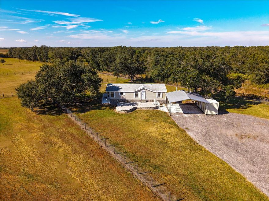 Welcome to peaceful country living at 14010 County Line Rd. in Myakka City. This inviting 10.2-acre property is perfect for anyone looking for wide-open space and a comfortable setup for their horses. The land features a 4-stall stable with an air-conditioned tack and feed room, along with three electric capable fenced pastures that make caring for and rotating your horses easy. You’ll also enjoy access to a stocked pond—great for relaxing by the water or casting a line at the end of the day. The owner offers full land maintenance for an additional $500 per month if you prefer to have the acreage cared for. Two tanks of propane per year are included for your convenience. If you’re looking for a quiet place with room for your animals and plenty of fresh air, this property is ready to welcome you home.