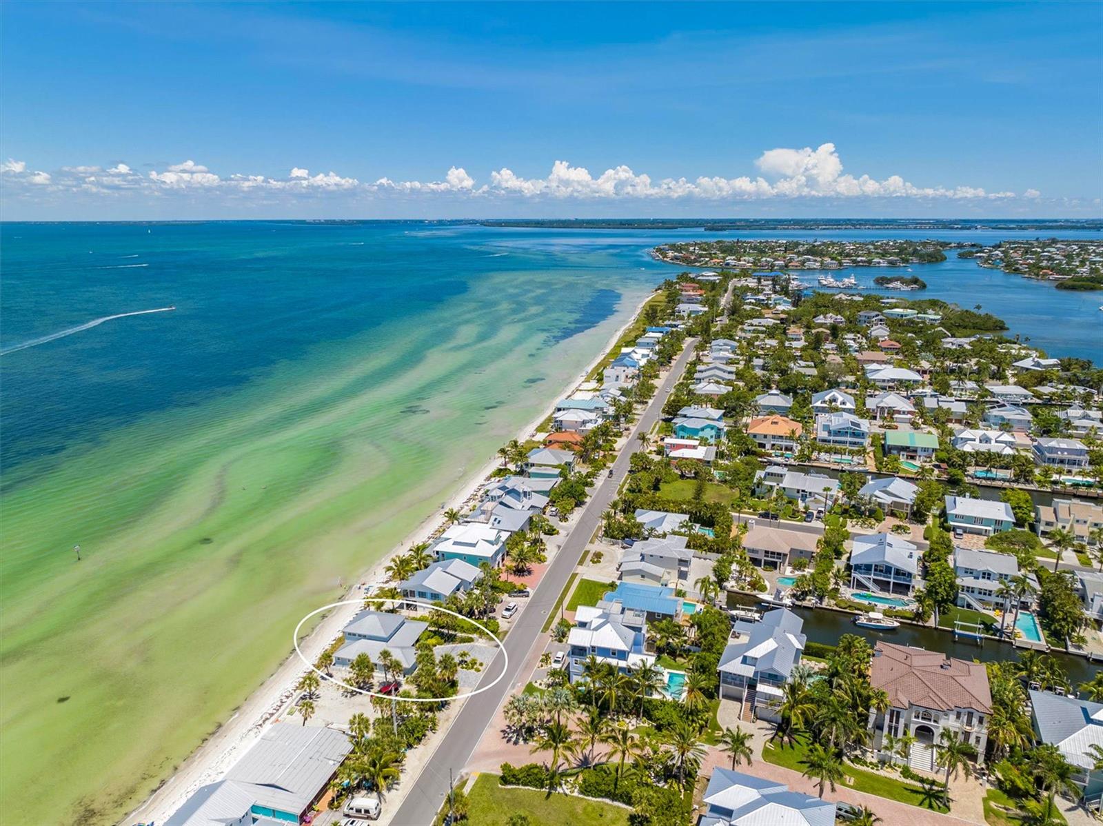 Anna Maria luxury at its finest! Picture perfect views are just one of the many spectacular features of this immaculate, updated waterfront home at 402 South Bay Blvd right in the heart of the city of Anna Maria. Experience the best of Island living in this stunning 3 Bedroom, 2 Bathroom, direct Bayfront property. You will be mesmerized by the powdery white sand beach and crystal blue Tampa Bay waters from the second you stroll through the double entry front door into the expansive great room. This beautiful home has a spacious, open floor plan that was meticulously designed with easy living, entertaining, and relaxation in mind. The home has a split floor plan with three large bedrooms and a bonus loft/ game room with 180 degree, panoramic views! This home also offers many recent upgrades, including new hurricane windows and doors, porcelain tile throughout, new carpet in the loft, shutters and motorized blinds, energy efficient lighting and fixtures, fully remodeled bathroom, updated appliances, newer air conditioning system with all ductwork redone, recent interior and exterior painting, newly finished epoxy garage floor, and updated professional landscaping and irrigation system. A full detailed list of upgrades is available for review. Also, this home has plenty of parking and storage with its 2 car garage and brick-paved, circular driveway. Bring your favorite beach toys and your golf cart! Please call for your private showing today. You will not want to miss out on your chance to own one of the most elegant, luxurious homes on Anna Maria Island in a prime location, within walking distance to the fine restaurants and boutique shops of Pine Avenue, The Anna Maria City Pier, Rod n’ Reel, and more!