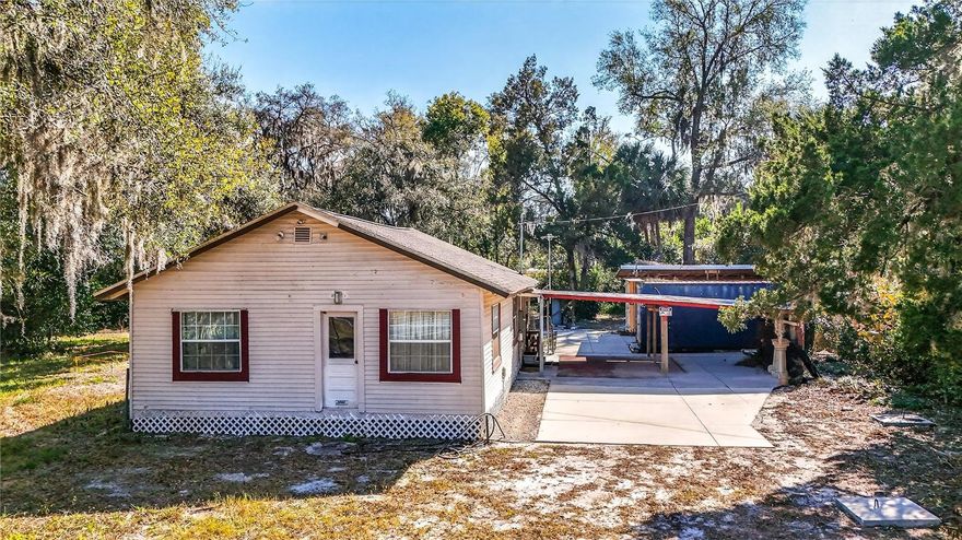 Opportunity! Over 1/2 acre on State Road 44 with possible commercial potential. Roof is 7 years old. There has been some work done to update interior but the value is in the land and potential.  The seller has professionally installed 2 store containers which are completely anchored down on concrete slabs and one has electric and cable installed as well as lighting and is used as a workshop.  The two are connected by a roof over top for all weather working.  There is a third storage container off to the rear of the yard with still half of the lot empty leaving plenty of room.  Perhaps a work from home woodworking shop or a welder.  Many possibilities.