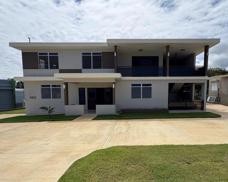 Price Improved! This beautifully renovated multifamily residence in Camuy offers both immediate livability and long-term potential. Situated on an ample lot in a quiet residential area, the property enjoys open surroundings and unobstructed ocean views from the upper level, an ideal setting for those seeking both space and coastal charm.

The first floor features four bedrooms, two bathrooms, a comfortable living and dining area, kitchen, laundry, and a covered terrace. Recent upgrades such as a solar water heater, water cistern, and power transfer switch ensure greater efficiency and convenience.

Upstairs, three additional bedrooms and two bathrooms are framed by sweeping views of the Atlantic, making this level well suited for extended family, guests, or rental income.

With zoning that allows for mixed residential and light commercial use, the property is also an excellent candidate for short-term rentals, boutique offices, cafés, or creative business concepts, subject to permitting. The spacious lot provides further room to expand or customize as needed.

A rare find in Camuy; move-in ready, income-ready, and future-ready.