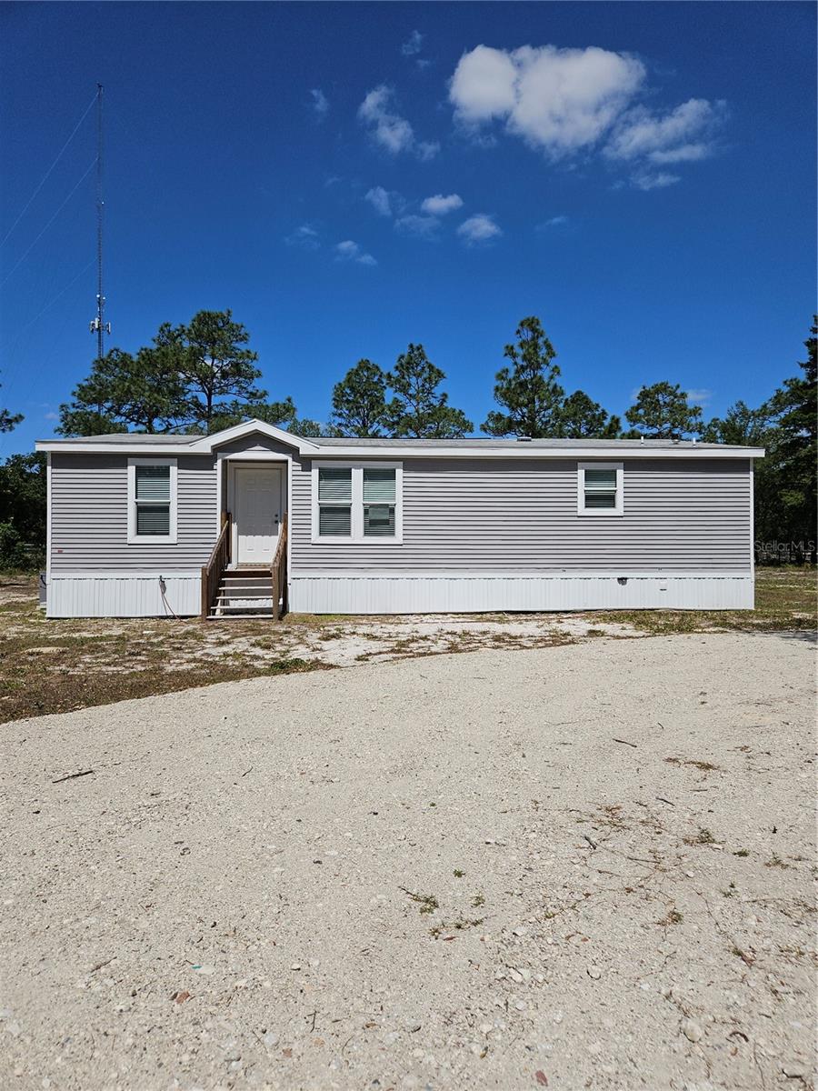 Discover tranquility in Weeki Wachee in this BRAND NEW 3-bedroom, 2-bathroom PALM HARBOR home nestled on nearly 2.5 ACRES of country charm. The VENTURA VI Model features an open and split floor plan with a handy laundry room adjacent to the kitchen. This rare gem sits high and dry and is zoned for agriculture. With no further work required, you're the final piece needed to complete it, so simply bring your farm animals, move in and enjoy. Enjoy the serenity of a super QUIET and PRIVATE dirt road with NO HOA and NO CDD. It's conveniently close to shopping, dining, entertainment, schools, Weeki Wachee, Pine Island, Chassahowitzka, and more. Suncoast Parkway and I-75 offer easy access to Tampa or Orlando.
