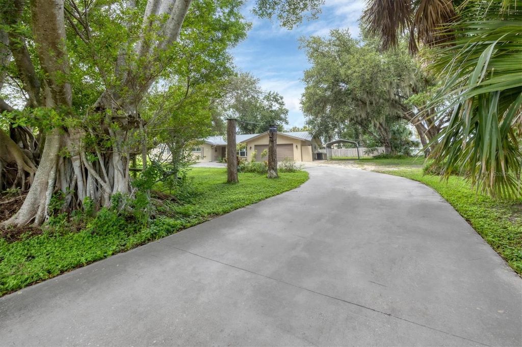 Photo of 336 Timbruce Lane NW, Port Charlotte, FL 33952 (MLS # N6140454)