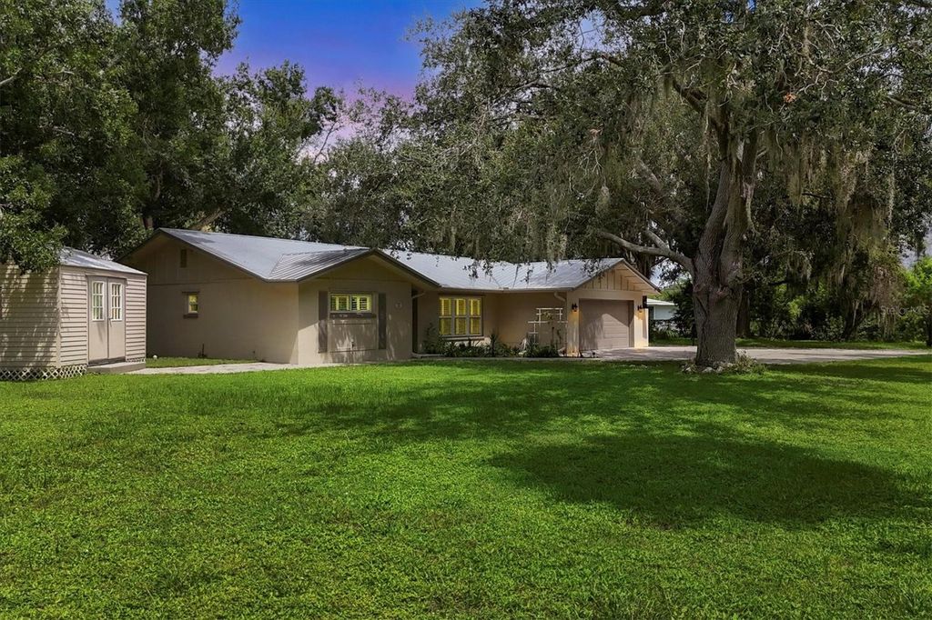 Photo of 336 Timbruce Lane NW, Port Charlotte, FL 33952 (MLS # N6140454)