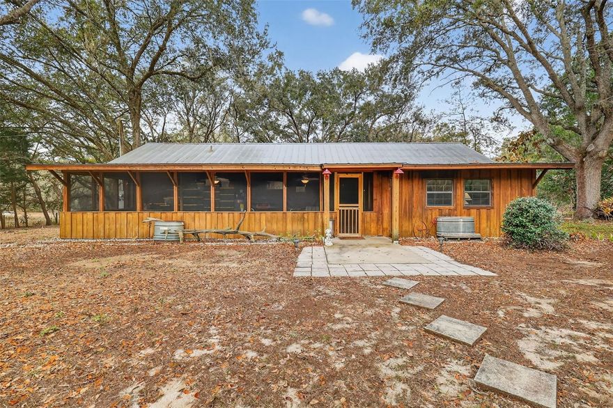 Acreage, equestrian, approximately 5-acre turnkey furnished horse property — Umatilla home for sale offering Old Florida living with room to roam, relax, and make it your own. Leave the noise behind and step into your own private, secluded retreat in beautiful Umatilla. This picturesque property showcases a blend of majestic live oaks, mature crêpe myrtles, and thoughtfully maintained landscaping that creates a quiet, peaceful, and serene wooded paradise with a true country living feel.

Whether you envision an equestrian retreat, a peaceful cabin tucked beneath the oaks, or the site of your custom dream home, the possibilities here are truly endless. With usable land, open space, and a private setting, this property is ideal for those seeking acreage, privacy, and flexibility. Outdoor features include a pergola with picnic area, perfect for relaxing or entertaining while enjoying the scenic surroundings. There is also an empty fish pond that could easily be restored into a tranquil koi pond or water garden.

Located in the back pasture, you’ll find a spacious pole barn with loft offering excellent storage and functional space, with strong potential for conversion into horse stalls, tack space, or a fully customized equestrian setup. This horse-friendly property offers room for animals, equipment, and recreational use. The property is equipped with two electrical sub-panels, one located at the front and another in the barn, making it ideal for RV hookup, camper parking, or additional equipment. An underground irrigation system services the property, helping maintain the lush landscaping and mature trees with ease.

Turn-key and fully furnished, this property comes complete with linens, towels, kitchen utensils, tables, chairs, beds, and household essentials, making it a rare opportunity for buyers seeking a vacation rental, Airbnb, VRBO, or income-producing property. It also serves perfectly as a private weekend getaway or peaceful retreat.

Conveniently located near Alexander Springs and the Ocala National Forest, the area is well known for horseback riding, trail riding, hunting, and outdoor recreation. The property is also just a short distance from the Lake Yale boat ramp, offering easy access to fishing, boating, and abundant Florida wildlife, while still being close to grocery stores and everyday conveniences.

If you’re searching for acreage, privacy, equestrian potential, and income opportunity all wrapped into one beautifully landscaped estate, this property delivers. Schedule your private showing and experience it firsthand.