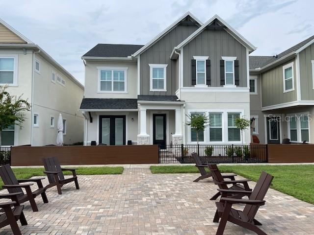 Home located in gated Lake Mary Midtown Community Griffin Park! This GORGEOUS and IMMACULATE 4-bedroom 3 bath highly popular Rustler model feels brand new with the PREMIUM lot overlooking Legacy Lawn. From the private, paved courtyard entry, you will be awestruck by the flexibility of this thoughtfully designed plan. The expansive front entry boasts a panoramic view of the main living area featuring the upgraded gourmet island kitchen, the expansive great room with built in wall unit and an abundant dining area. The stunning kitchen provides for loads of upgraded double-stacked cabinetry and counter space, gas cooking, wall oven and microwave, stainless steel appliances and a large walk-in pantry with custom wooden shelves. The wet island provides snack bar seating for several guests as you cook and entertain. There is a full main level guest suite which could serve spectacularly as an in-law suite or office and a full bath with walk in shower. There is a large, finished storage area under the stairwell. The second level offers the massive owners retreat featuring an ensuite master bath with walk-in rimless shower, a soaking tub, dual sinks with touchless faucets with a spacious vanity area, and a large walk-in closet with a double-sided island vanity. There are two additional bedrooms, a bathroom with tub/shower, large laundry room with sink, cabinet and countertop, and a flex space or loft area which could be utilized as a second/upstairs living area, TV/Media room, home office, home gym, or many other possibilities. So many beautiful, modern and tasteful details including prewire surround system and alarm, gorgeous luxury vinal plank flooring on the first floor, large closets in all rooms and plantation shutters throughout the whole house. The owners thought of everything so all you need to do is move right in and start enjoying this care-free, Florida lifestyle. Griffin Park is a true resort-like lifestyle with low maintenance! The HOA includes landscaping, Olympic size Community Pool and Cabanas, and Dog Park. Located in the Seminole County School District and near Seminole State Collage, UCF, Full Sail University, numerous shopping meccas, restaurants, professional and corporate office complexes, and medical centers. You can walk to the gym, grocery store, and several restaurants. Convenient commuting to Orlando International Airport and Sanford Airport via I-4 Express/Expansion, downtown Orlando, and close to beaches AND them parks! Truly an exceptional home at and exceptional value.
