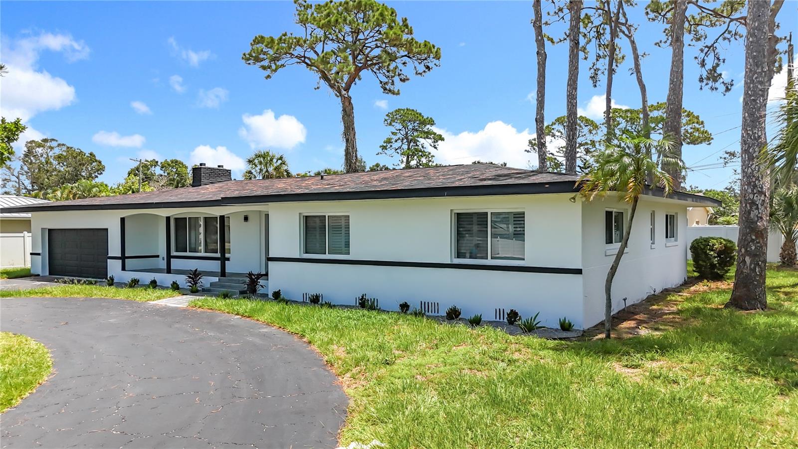 Beautifully updated 3BR/2BA home on a large corner lot in South Pasadena Golf Club Estates. This stunning property features a spacious open layout with a large bonus room ideal as a family room or home office. Enjoy a modern kitchen with brand-new cabinets, Calacatta quartz countertops and backsplash, and new stainless steel appliances. The home is freshly painted inside and out, with elegant 24x48 porcelain tile flooring throughout and two fully renovated bathrooms with high-end finishes.
The oversized 2-car garage and circular driveway ample parking. Located in a quiet, family-friendly neighborhood just minutes from Downtown St. Petersburg and within 5 miles of top attractions including the St. Pete Pier, Salvador Dalí Museum, Museum of Fine Arts, Morean Arts Center with the Chihuly Collection, the historic Sunken Gardens, and waterfront parks like Vinoy Park, plus nearby beaches perfect for families and friends.
"No HOA" . Schedule your showing today!