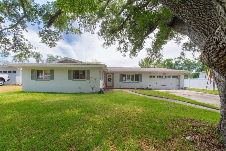 Welcome to Harbor Lake Estates, one of Largo’s most desirable and established neighborhoods, where spacious homes, oversized lots, and a prime location come together to create the perfect Florida lifestyle. This beautifully updated 3-bedroom, 2-bath pool home offers nearly 2,000 heated square feet of comfortable living space with a functional layout designed for both everyday living and entertaining. Inside, you’ll find an updated kitchen and renovated bathrooms, an interior laundry room, and a spacious split-bedroom floorplan filled with natural light. The second bedroom even features a newer mini-split system for added comfort and efficiency. Step outside to your oversized screened lanai overlooking the sparkling pool and expansive backyard spanning over a quarter of an acre — plenty of room for entertaining, gardening, pets, or simply enjoying the Florida sunshine. Major updates provide peace of mind, including HVAC and ductwork in 2023, plumbing updates in 2024, windows in 2021, roof in 2018, a newer energy-efficient water heater, and a newer pool pump. The oversized 2-car garage adds even more convenience and storage. Harbor Lake Estates is loved for its tree-lined streets, welcoming atmosphere, and convenient access to award-winning Gulf beaches, shopping, dining, parks, golf, and top commuter routes, making it easy to enjoy everything the Tampa Bay area has to offer.