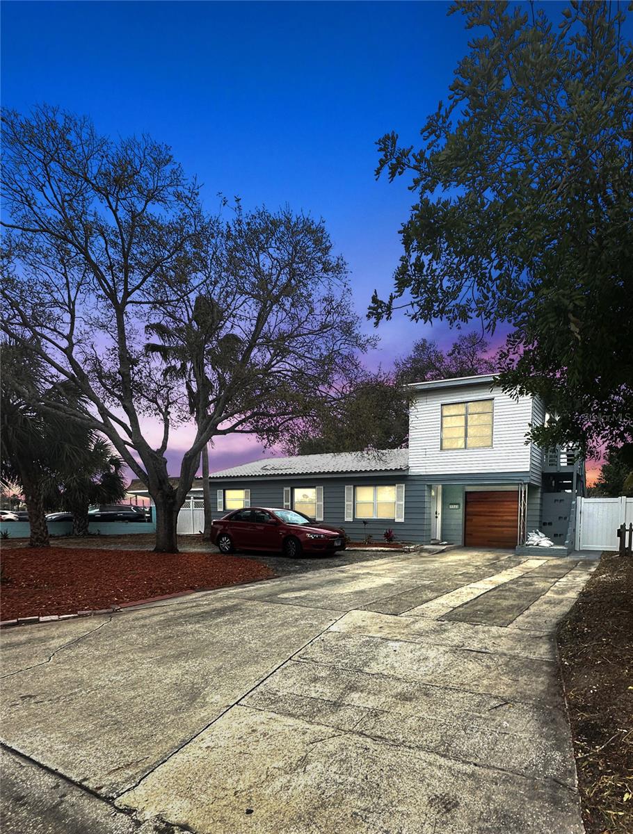 One or more photo(s) has been virtually staged. Welcome to this updated 3-bedroom, 2-bath home in St. Petersburg’s Tyrone area. With two living rooms and a complete mother-in-law suite above the garage, it’s designed for flexibility—perfect for extended family, guests, or a private workspace.
Inside, you’ll find durable laminate flooring, a refreshed kitchen with wood cabinets and stone counters, and plenty of natural light throughout. The spacious layout gives you options for both gathering and quiet retreat.
The separate mother-in-law suite is a standout feature, offering its own bedroom, bathroom, and living area—ready for multigenerational living, home office, home gym or extra privacy when needed.
The backyard has room for gatherings, gardening, or future projects, and the oversized garage provides ample storage. Located near schools, shopping, dining, and the beaches, this home is move-in ready and practical for everyday living.