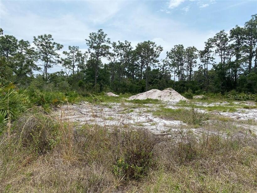 Rare Mixed-Use 0.54 acre lot in beautiful Lake Estates, only 1/4 mile off HWY 60, in Lake Wales, FL. Residential but has commercial component (NACX ZONING). Anyone who wants to run a business from their home can legally do it here! This is called a Neighborhood Activity Center; NACX. Residential structure can have a business component - CPA, Beauty Salon, Real Estate Broker, Lawyer, Doctor, General Contractor, Repair shop, Barber Shop, Plumber's office with displays. All uses must be approved by the County. Great for entrepreneurs who work from home.
Lake Estates has a beautiful lakefront park and golf course, which has become very popular! Fish for Large Mouth Bass in the 7,500 Acre Lake Walk in the Water. Boat ramp accessible, so you can keep your boat at home, and your RV too. Or use the 1,000 foot fishing pier or just watch sunsets! Paved road. City water available. Septic needed. Lot has been cleared of trees and dense foliage.
Survey available. Septic permit and plans were done for proposed duplex previously. Might be easier to redline current plans and just renew septic permit.
More details:
This site is located within a Neighborhood Activity Center (NACX) land use district in Lake Estates. The purpose of the NACX district is to provide for the daily shopping needs of residents within neighborhoods surrounding the center. The NACX district includes non-residential uses such as offices, grocery stores, drug stores banks and community facilities. Residential uses are permitted with centralized water at a density of 4 DU/AC; however, residential uses are limited to connection with retail as a mixed-use or live-work unit.