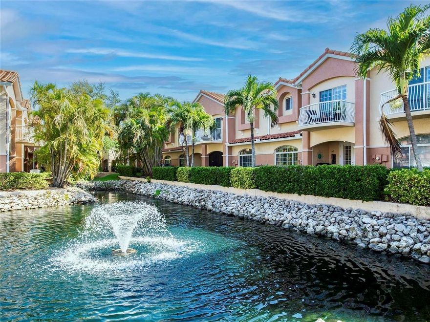 METICULOUSLY maintained townhome in the gated community of Villas Del Verde, is located in a NO FLOOD ZONE and sustained NO damage from Hurricanes Helene or Milton, offering exceptional peace of mind. This 2332 sq.ft, 3-bedroom, 2.5-bath, 2 car garage residence is ideally situated near the prestigious Pasadena Yacht and Country Club. The location is exceptional—just minutes from pristine Gulf Coast beaches, downtown St. Petersburg, and convenient interstate access. Enjoy close proximity to fine dining, museums, theaters, professional sports venues, and the iconic St. Pete Pier, with Tampa and Tampa International Airport approximately 30 minutes away. Thoughtfully updated and truly move-in ready, this home features a newer A/C (2024), water heater (2023), hurricane-impact windows, and custom plantation shutters throughout. Interior highlights include an inspired chef’s kitchen with abundant storage, crown molding, engineered hardwood flooring, custom built-in shelving in the den/office, a security system, and a water softener. A serene fountain just beyond the lanai creates a private, tranquil retreat. The spacious primary suite is a true sanctuary, offering two expansive walk-in closets and a spa-inspired en-suite bath with soaking tub and separate shower. A charming balcony adds a refined architectural touch. The oversized two-car garage is impeccably finished with interlocking tile flooring and ceiling-mounted storage. Residents enjoy resort-style amenities, including a heated pool, spa, fitness center, and a beautifully renovated clubhouse that hosts community social events. PET-FRIENDLY community. A rare opportunity to enjoy refined living, an exceptional location, and the very best of the Florida lifestyle.