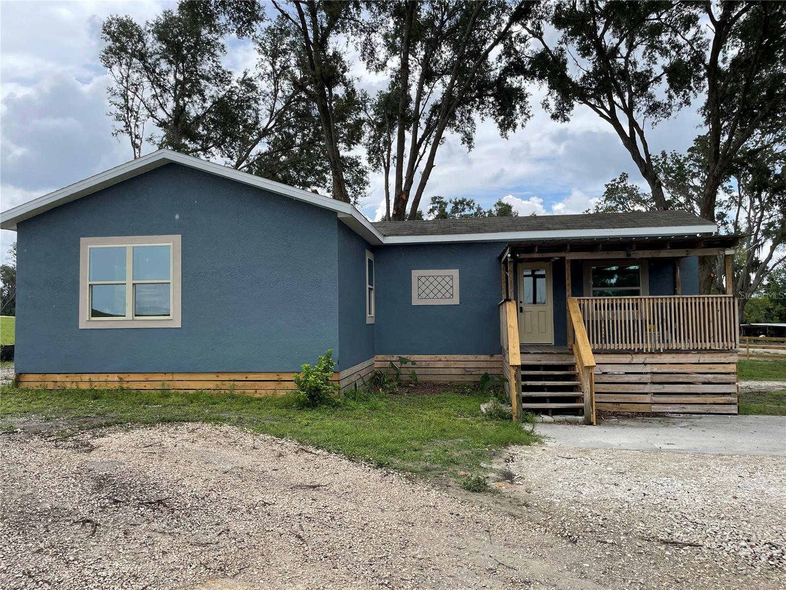 Escape to your own slice of paradise with this stunning, newly remodeled 2-bedroom, 2-bathroom retreat, perfectly perched on ~2 acres of sprawling land in the serene Wesley Chapel countryside! Blending trendy rustic charm with modern flair, this home dazzles with sleek stainless steel appliances, stylishly upgraded bathrooms, and a fresh interior designed for comfort and rustic vibes. Unwind on the charming covered front porch soaking in peaceful rural views, or let your creativity run wild in the expansive yard—perfect for gardening, parking your boat or RV, or simply basking in nature’s embrace. With a new washer and dryer included and no credit checks required, this move-in-ready gem makes country living a breeze. Nestled in a quiet, scenic pocket yet just a short drive from Wesley Chapel’s modern conveniences, this home offers the ultimate balance of tranquility and accessibility. Contact us today to schedule a showing and claim this chic countryside haven as your new home!