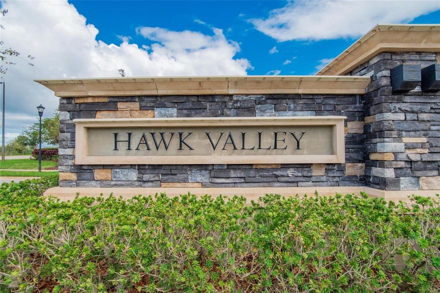 Welcome to Hawk Valley, at K-Bar Ranch New Tampa. Originally built by M/I homes this is the only legitimate 3 bedroom, 2 full bath villa on the market. Built in 2019 the owners have kept this home in mint condition. Equipped with Luxury Vinyl Plank flooring, Tray Ceilings and an Open Floor plan for entertaining. The screened-in Lanai has been retrofitted with Retractable Solar shades to elevate your experience when enjoying your outdoor space. The primary suite delivers with its massive bathroom/closet that features dual vanity sinks, ample storage and a walk-in/wheelchair accessible shower you can get lost in. Hawk Valley is a pet friendly space that is ideal for anyone who's looking for luxury living without the hassle of worrying about lawn-care, pest control or irrigation because the community takes care of it all for you through their excellently run management. The community has access to a resort-style pool, club house, pickle ball and tennis courts, plus a children's playground. If that's not enough, you're going to love having some of the best Golf Courses Tampa Bay has to offer, Heritage Isle and Lexington Oaks to name a few.  Conveniently located near the Tampa’s Premium Outlets, 40 minutes from downtown Tampa, and easy access to I-275/I-75 for those commuting to Tampa's prestigious International Airport. Come see why this unit soars above the rest at Hawk Valley!