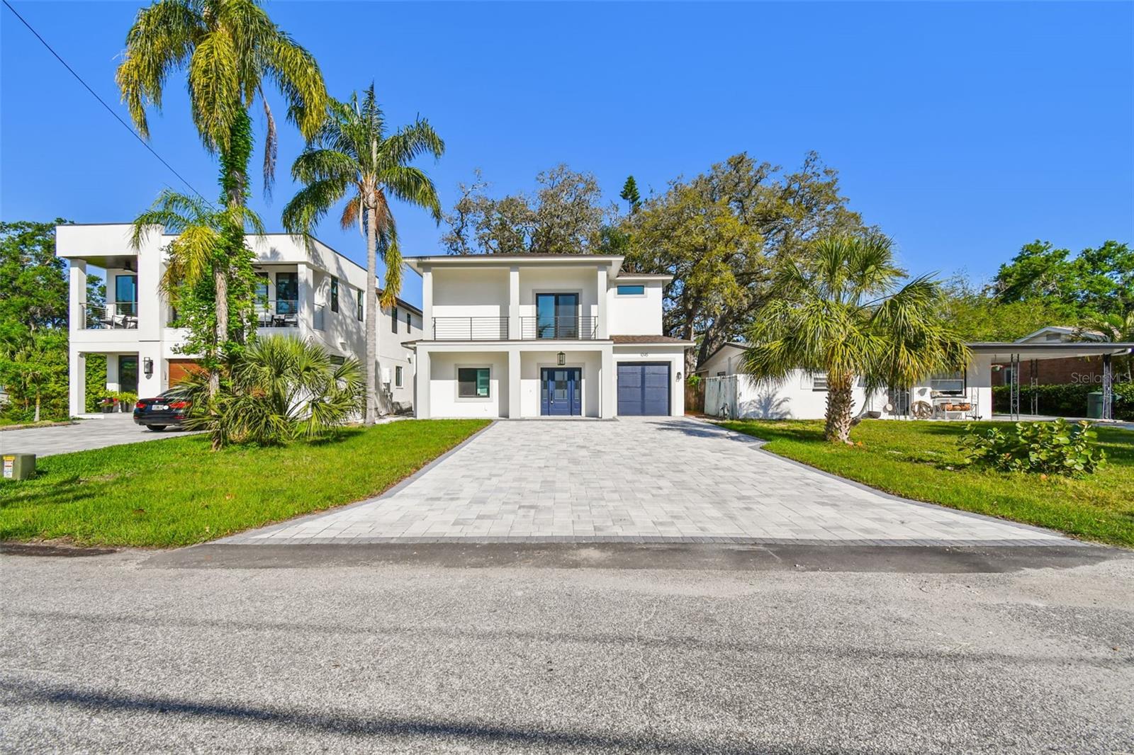 Experience your dream home in this thoughtfully designed, newly built, single family residence, in sought after Safety Harbor. Here, you'll live walking distance to downtown Safety Harbor and one block from the Bay. Experience numerous outdoor living areas and a third story terrace - your own private oasis! Inside you will be greeted with an open layout - the main floor has two bedrooms - a downstairs master, and a guest room or office - as you wish! Step into a kitchen with an oversized book-matched quartz island, large enough to fit the entire family. This area also has its own wine and bar room, flowing right outside to one of four private outdoor living areas - perfect for living and entertaining. Adorned with custom hard wood cabinets as well as Delta faucets and fixtures throughout, you'll be surrounded by quality. Enjoy plenty of natural light throughout the home via your brand-new hurricane impact rated windows. This house is a great size but yet still offers you a sizeable front and back yard with covered patios. The trees were purposefully maintained to provide ample shade to allow for residents and guests to enjoy Florida's outdoor lifestyle. You'll live and entertain here as the open kitchen area offers pass-through windows to entertain family and friends, maintaining a connection with the outdoors at each turn. Upstairs you'll find a second family room, theatre room, and three more bedrooms with high ceilings. Spacious closets, and a Jack and Jill bathroom await you here. A master with two walk-in closets, a double shower with body sprays, balcony, and more! Enjoy the convenience of a spacious second-floor laundry room with natural gas hookups. Relax on your back deck or walk upstairs to entertain guests on your very own, unique, sizeable, and private third story crow's nest! Here you can take in the water views of Tampa Bay or stargaze at night! This one-of-a-kind home offers instant equity as compared to new builds coming up in downtown Safety Harbor.
Furthermore, buy this dream home with peace - it is up and out of a flood zone, and is built to stand - no issues at all through last year's hurricanes. Come by and take a look!