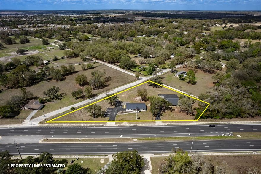 Exceptional commercial opportunity on high-traffic SW Highway 200 / College Road in one of Ocala’s most active growth corridors. This B-2 zoned 2.23-acre corner parcel offers outstanding visibility with approximately 420 feet of highway frontage, 5 offices and large lobby area positioned near Lowe's Home  Improvement and surrounded by established retail, professional services, and expanding residential communities.
The property features two existing structures, including a renovated 2,376 SF office/showroom building with flexible interior space suitable for office, showroom, professional services, or retail use, plus a concrete block secondary building with former horse-stall construction offering additional storage, workspace, or adaptive-use potential.
Its corner location provides strong access, excellent exposure, and multiple possibilities for owner-users, investors, or future redevelopment. The site’s commercial zoning allows for a wide range of business uses, making it ideal for medical, office, retail, service-based business, or mixed commercial concepts.
An added advantage: adjacent parcels may also be available. Rare opportunities like this along Highway 200 are increasingly limited.