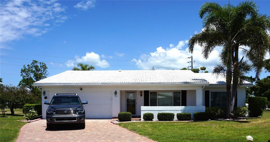Welcome to this highly sought-after 2-car garage home offering stunning water and golf course views in a vibrant 55+ community. This beautifully maintained Gormay model (1776 sf) is truly move-in ready, showcasing pride of ownership throughout. The home features 2 spacious bedrooms, 2 full bathrooms, and a desirable open layout designed for comfortable living. Enjoy your morning coffee on the partially covered front porch, or unwind in the covered rear patio overlooking serene water views and local wildlife—perfect for relaxing or entertaining.
Residents benefit from a nearly maintenance-free lifestyle, with a comprehensive monthly HOA that includes water, sewer, trash removal, exterior painting, internet, cable with DVR, lawn care, and reclaimed water irrigation. This pet-friendly neighborhood allows up to two pets, making it an ideal choice for animal lovers. The community is centered around an 18-hole public golf course and offers an array of amenities, including a heated pool, shuffleboard courts, and an active clubhouse filled with social events and activities. Nearby is Freedom Lake that provides walking trails, a dog park, picnic areas, and more opportunities to enjoy the outdoors. Conveniently located with easy access to US-19, this home is just minutes from Gulf beaches, airports, shopping, dining, medical facilities, and major Bay Area bridges. Best of all, no flood insurance is required. Experience the perfect blend of comfort, convenience, and community living in this exceptional home.