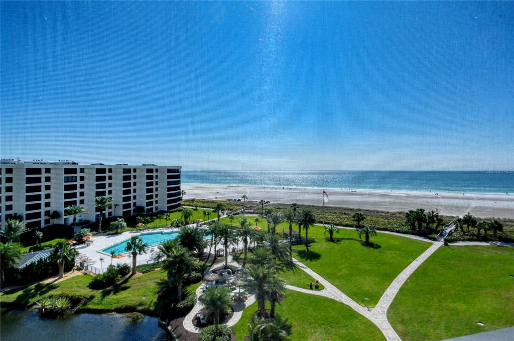 Find your paradise at Gulf & Bay Club on coveted Siesta Key Beach! The white powdery quartz sand beach and the Gulf of Mexico are just steps away from this top-floor unit. This condo has been completely remodeled to reflect the contemporary style so sought after today. You will find Durastone porcelain tile floors, quartz countertops, plantation shutters, and solid core doors throughout. The kitchen boasts white cabinets, stainless built-in GE Monogram appliances, can lighting as well as pendant lights over the huge island that seats four. The entryway closet has a window and could easily be converted to a workspace. Both bedrooms have king-size beds and both bathrooms have walk-in showers with floor-to-ceiling tile. The laundry room has a full-size washer & dryer and storage cabinets. Nowhere else on Siesta will you find the abundance of amenities that this prestigious resort community offers. Gulf & Bay Club is a 32-acre property on 800 ft of private beach. With its 6 tennis, 6 pickleball, racquetball, basketball, and shuffleboard courts, 3 swimming pools, dry saunas, multiple BBQ areas, fitness center, and indoor spa, you won’t have to go far to find something to do. There are two clubhouses, one with a pool table, media facilities, and a library at your disposal. Wi-fi is available throughout the property. Driving an electric car? No problem, as G&B Club offers charging stations as well as a car wash area. With 24-hour security and a guest suite that can only be rented by owners, this gated community has it all. Being offered Turnkey Furnished. At 704E, on Siesta Key, it’s all about the view, inside and out!