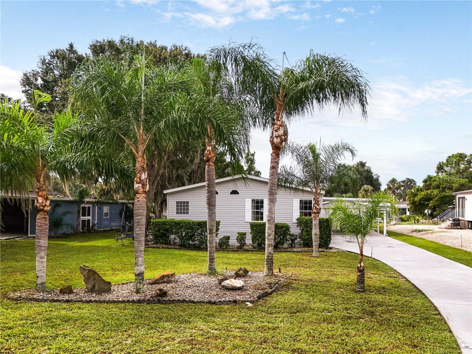 How would you like to own a property with direct access to the Chain of Lakes for under $400K?
Here is your chance!
This diamond is not in the rough. Located on the canal that leads straight to Lake Eustis. Hop on your boat that is stored in your recently constructed, covered boat dock and head to supper at a nearby lakeside restaurant.
Enjoy your morning coffee by the pool and take that swim to get the day started.
This 4 bedroom, 2 bath home has soaring ceilings that add to the elegance of daily life. Use your space as you like. Extra bedrooms and a bonus area are awaiting a living room, playroom or craft room. The beautiful yard is maintained by irrigation which is provided by the canal which saves you money.
A handy kitchen with a host of cabinets and storage, makes large gatherings a breeze as it is open to the eat in kitchen and has easy access to the large formal dining area. Plenty of parking for all of your guests.
The oversized garage is amazing. Dual doors that allow for drive-through, make dropping that trailer, bike or other toys so convenient.
A huge primary bathroom is a dream and this place has it.
If you want to get away from the hustle and bustle of traffic, this is your own little paradise. Just a short drive to the nearby, quaint towns of Leesburg, Mount Dora and Eustis. A little over an hour to Orlando, Disney and Universal attractions. Only an hour and 20 minutes to the beach.
Make your appointment today to see this property.
A/C, 2006
Roof, 2018
Boat house, 24 X 13
Boat on property does not convey.