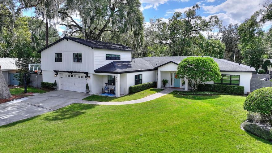 To live in Winter Park is to embrace the best of Central Florida: tree-lined streets and top-rated schools, boutique shopping on Park Avenue, vibrant restaurants and cafés, a beloved farmers’ market, and world-class museums and gardens. Outdoor enthusiasts delight in the lakes, trails, and parks, while proximity to AdventHealth’s main campus and Downtown Orlando ensures everyday convenience.  
At 640 Arjay Way, that lifestyle is elevated to something extraordinary. This 5 bedroom, 3 full plus two half bath home has been lovingly remodeled in the European tradition, with the emphasis on quality, timelessness, style, and ease.  Wake to the sound of whispering oaks and birdsong, then step into the Florida room, where terrazzo floors honor the home’s mid-century modern origins. Sunlight pours through a two-wall bank of French doors, dissolving the boundary between indoors and out. Morning coffee on the covered terrace, overlooking the glistening travertine surrounded, pebble-tech pool with Baha Sun Shelf entry, inlaid glass mosaic tile, and tropical Areca palms, sets the tone for the day.  From there, the day unfolds as freely as the renowned Winter Park peacocks roam. A climb into the storybook tree house tucked high among the oaks, while a friendly match unfolds on the sand volleyball court or ping pong table below.
Inside, nearly 4,000 square feet under air balances elegance with comfort. A gracious formal foyer with vaulted ceiling, millwork paneling, and hidden storage gives way to an open plan anchored by a soaring white brick fireplace and hearth. The chef’s kitchen impresses with a sweeping quartz island, 48” gas cooktop, butler’s pantry with wine refrigerator, farmhouse sink, and showcase cabinetry. The formal dining room, flanked by a butler’s service area, rises to a dramatic cathedral ceiling with serene garden views.
The primary suite is a private retreat, featuring an immense built-in closet and a spa-inspired bath with seamless glass shower, porcelain tile with marble inlays, oversized slipper tub, and exquisite custom cabinetry. Two additional bedrooms and a flexible gym/office/studio complete the downstairs. Upstairs, a separate wing offers two bedrooms, one bath, and a loft—ideal for guests or family. In the garage, a workshop and generous storage provide function without compromising style.
Outdoors, the possibilities unfold in every direction: a custom gazebo-covered kitchen with solid wood counters and grill for alfresco dining, a banquette-surrounded fire pit lounge for cozy evenings, a covered outdoor living and dining room, the aforementioned sand volleyball court (that has already inspired championship play), and draped aside the tree house, chandeliers and caravan lights set the stage for gatherings that stretch into the night.
From quiet mornings to joyful afternoons and lively evenings, this home lives as beautifully as it entertains — a rare Winter Park retreat where architecture, nature, and lifestyle quietly converge.