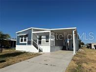 Brand New! Presenting a fantastic opportunity to rent a brand-new double wide manufactured home with exceptional features in this award winning 55+ community. This spacious residence boasts 2 bedrooms, 2 baths, a bonus office or den, and a delightful covered front porch. Step inside this modern home and discover a world of comfort and style. Each room is equipped with ceiling fans, ensuring a cool and pleasant atmosphere year-round. The open layout seamlessly connects the living spaces, creating a welcoming and inclusive environment for you and your loved ones. The kitchen is a culinary enthusiast's dream, featuring sleek stainless steel appliances that effortlessly blend form and function. The convenient island offers additional countertop space, making meal preparation and entertaining a breeze. Whether you're hosting a dinner party or enjoying a casual family meal, this kitchen is sure to impress. Retreat to the private bedrooms, where relaxation and tranquility await. The master suite provides a peaceful oasis, complete with an attached bathroom and ample closet space. The second bedroom is perfect for guests or as a cozy retreat for family members. Additionally, the bonus office or den provides a versatile space that can be tailored to your specific needs, whether it be a home office, library, or hobby room. One of the highlights of this home is the inviting covered front porch, ideal for enjoying a morning cup of coffee or unwinding after a long day. This outdoor space offers a peaceful setting to soak up the Florida sunshine or gather with friends and neighbors. As a resident of Harbor Isles, you'll have access to a range of community amenities, including a clubhouse, swimming pool, fitness center, and more. Enjoy the Florida lifestyle to the fullest with this remarkable manufactured home in a highly sought-after location. Don't miss out on this incredible opportunity to rent a new home.