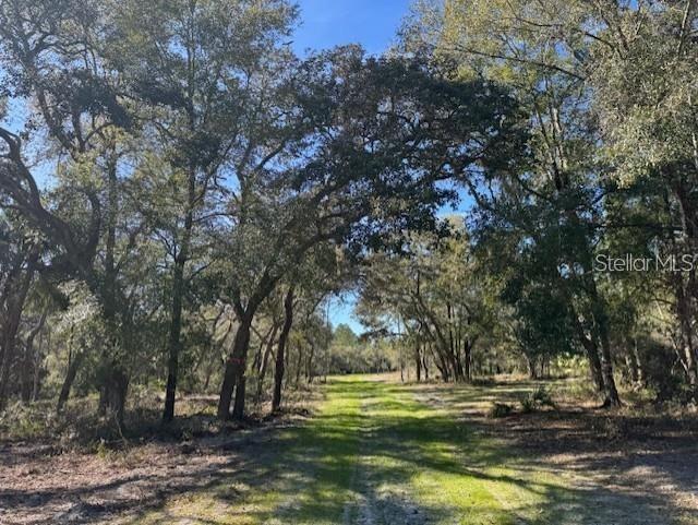 16.03 acres of peace and quiet along the Florida Greenway, this property has a large array of wildlife and trails that allow you to explore a piece of Old Florida. This property was recently approved for an AG lot Split. Build your Dream rural home or use for a hunting retreat.