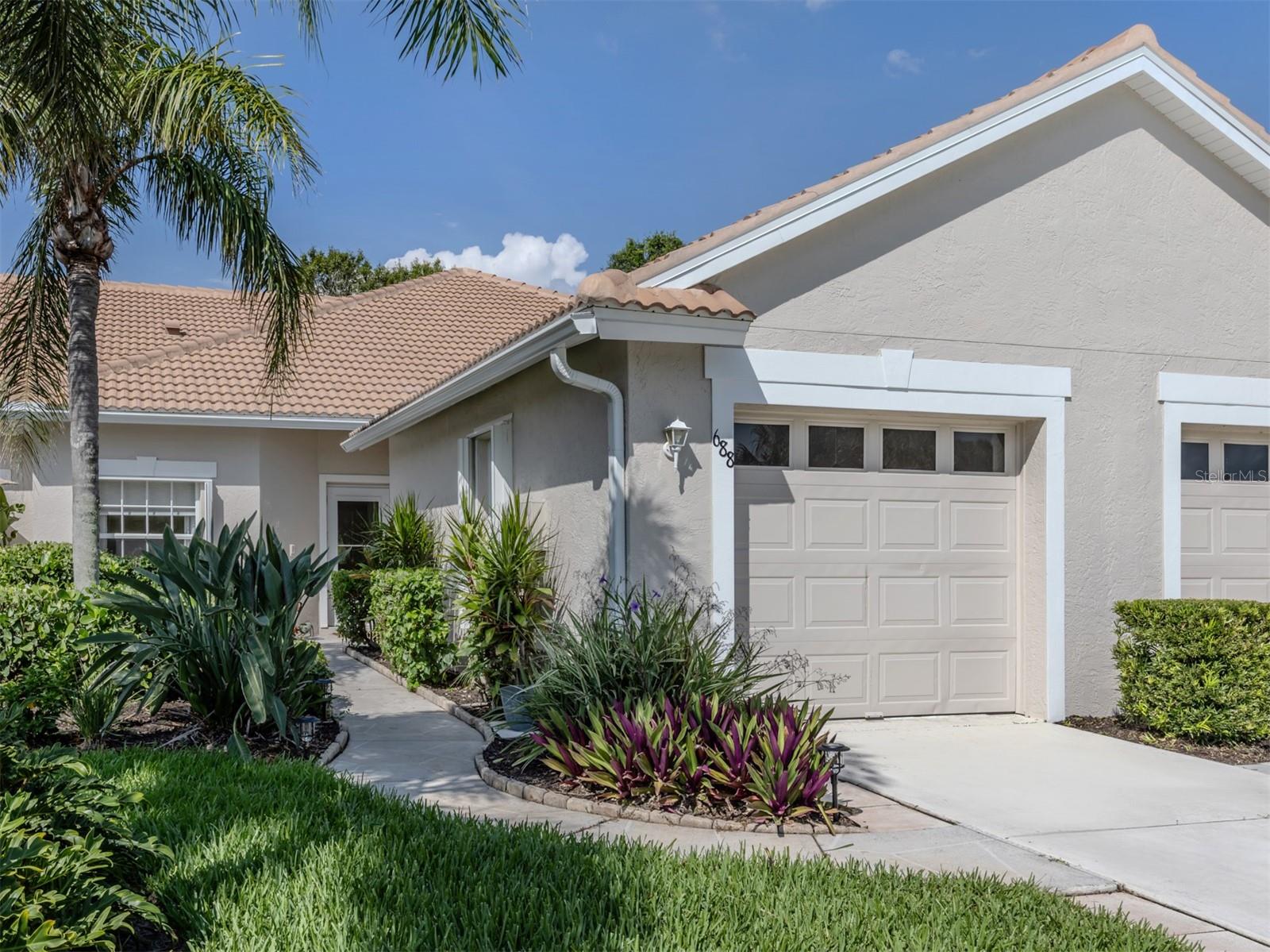 Turnkey Villa in The Links at Pelican Pointe – Updated, Bright & Priced to Sell! More Pictures are coming soon.
This move-in-ready 2-bedroom, 2-bath villa is located in the desirable Links neighborhood of Pelican Pointe—just steps to the neighborhood pool, mailboxes, and a peaceful fairway, well out of range of stray golf balls. Thoughtfully designed to maximize natural light, this villa feels open and bright throughout, with fresh paint and new ceiling lighting to enhance the space. The open-concept living area includes a large TV mounted on a sleek, sound-enhancing backboard—a stylish and functional focal point. Offered fully furnished with all-new furniture, this home is truly turnkey and ready for immediate enjoyment. A charming front courtyard patio overlooks the 14th hole of the Preserve course, while the covered rear lanai offers a peaceful view of the natural Preserve—ideal for relaxing and entertaining outdoors in comfort and privacy. Whether you're hosting guests for an informal BBQ or seeking a quiet space for your personal yoga practice, this villa offers flexibility to fit your lifestyle.
In addition to existing features like the tile roof (2022), A/C and water heater (2023), and stainless steel kitchen appliances, the sellers have made thoughtful upgrades including brand-new furnishings and decor throughout, a premium LG ThinQ washer and dryer, and the installation of a leaf gutter protection system for low-maintenance living.
Pelican Pointe offers resort-style amenities included in your HOA fees: clubhouse, heated pool, tennis, pickleball, on-site restaurant/bar, and year-round social events. Also included in HOA fees: External building maintenance, irrigation, pest control, basic cable, and basic internet. Optional membership to the private 27-hole championship golf course is available. Just minutes to Gulf beaches, shopping, dining, and historic downtown Venice.
