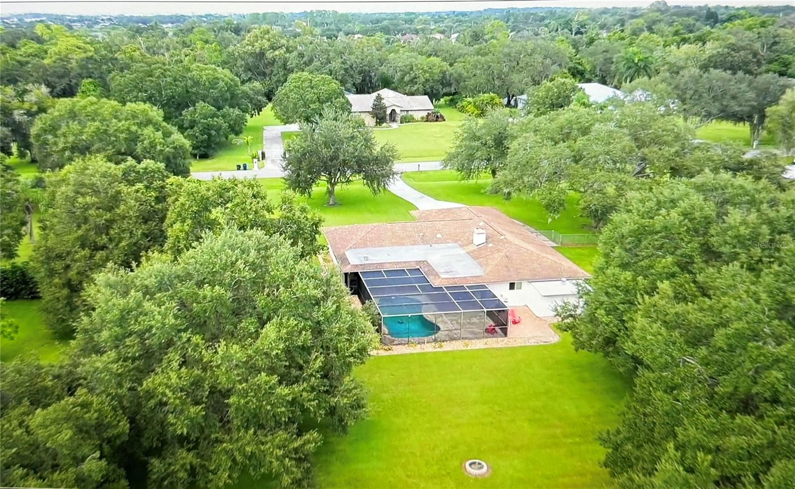 Rare Opportunity in Prime Sarasota Location - 5BR/3BA Pool Home on 1 Acre with No HOA
2025 update adds 10 years life to flat roof on 4-Point inspection!
Tucked away on a peaceful street in one of Sarasota’s best kept secrets, this spacious 5-bedroom, 3-bathroom home offers privacy, comfort and convenience. Situated on over 1 acre of land between SRQ and UTC with a fenced yard, mature oak trees, and no mandatory HOA, this property is a rare find in a neighborhood where homes seldom come on the market.
With 3645 total square feet of living space (2354 under air), this home is move-in ready and for families, multi-generational living, or income-producing rentals. Zoning for horses and an additional dwelling unit increases its potential.
Enjoy the Florida lifestyle with a caged pool and lanai, featuring new lights and fans, providing for spacious outdoor relaxation and entertaining. Grill on the adjacent patio, and set up yard games on the expansive lawn.
Inside, enjoy an updated kitchen with quartz countertops and modern lighting and 3 full, renovated bathrooms. The bright, open layout includes a large stone fireplace, several tube skylights, and newer impact-rated double paned windows and sliding glass doors (2021) with a lifetime warranty for peace & quiet and peace of mind.
Other upgrades include:
New roof (2010) with 30-year transferrable warranty. Flat roof sealed (2025)
Oversized septic system (2022)
Oversized 2-car garage + long RV-ready driveway
Attached shed
Fireproof floor safe
Flood zone X
$44/month water bill
Space, privacy, and flexibility in this premium Sarasota location. Buy today and stay a lifetime. Open to work with licensed professionals.