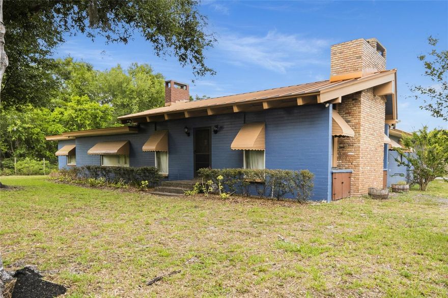 Set on nearly three acres, this one-of-a-kind property is equal parts retreat, homestead, and opportunity. Room to breathe. Room to grow. Room to build something that is entirely your own.
The main residence wraps you in warmth the moment you walk in. A great room with real brick floors, soaring ceilings, wood planking, exposed beams, and a sprawling brick fireplace sets a tone that no new construction can replicate. Three bedrooms, two bathrooms, and character that cannot be built from scratch.
Step outside and the full scope of this property comes into view.
Nearly three acres of usable land, thoughtfully laid out for a working homestead or hobby farm. Two expansive pastures ready for grazing. A barn with stalls/pens. A separate animal pen with six individual enclosures. Two oversized workshops for tools, equipment, projects, or whatever your vision demands. Every structure has a purpose. Every corner of this land has potential.
Clarcona Horse Park is just minutes away, with competition rings, stalls, and direct access to the 22-mile West Orange Trail equestrian path. Wekiwa Springs State Park is close by for paddling, hiking, and riding through one of Central Florida's most beautiful natural preserves. Quick access to the 429 and 408 keeps Orlando, Winter Garden, and the broader metro well within reach whenever you need it.
This kind of acreage, this close to everything, simply does not come available often.