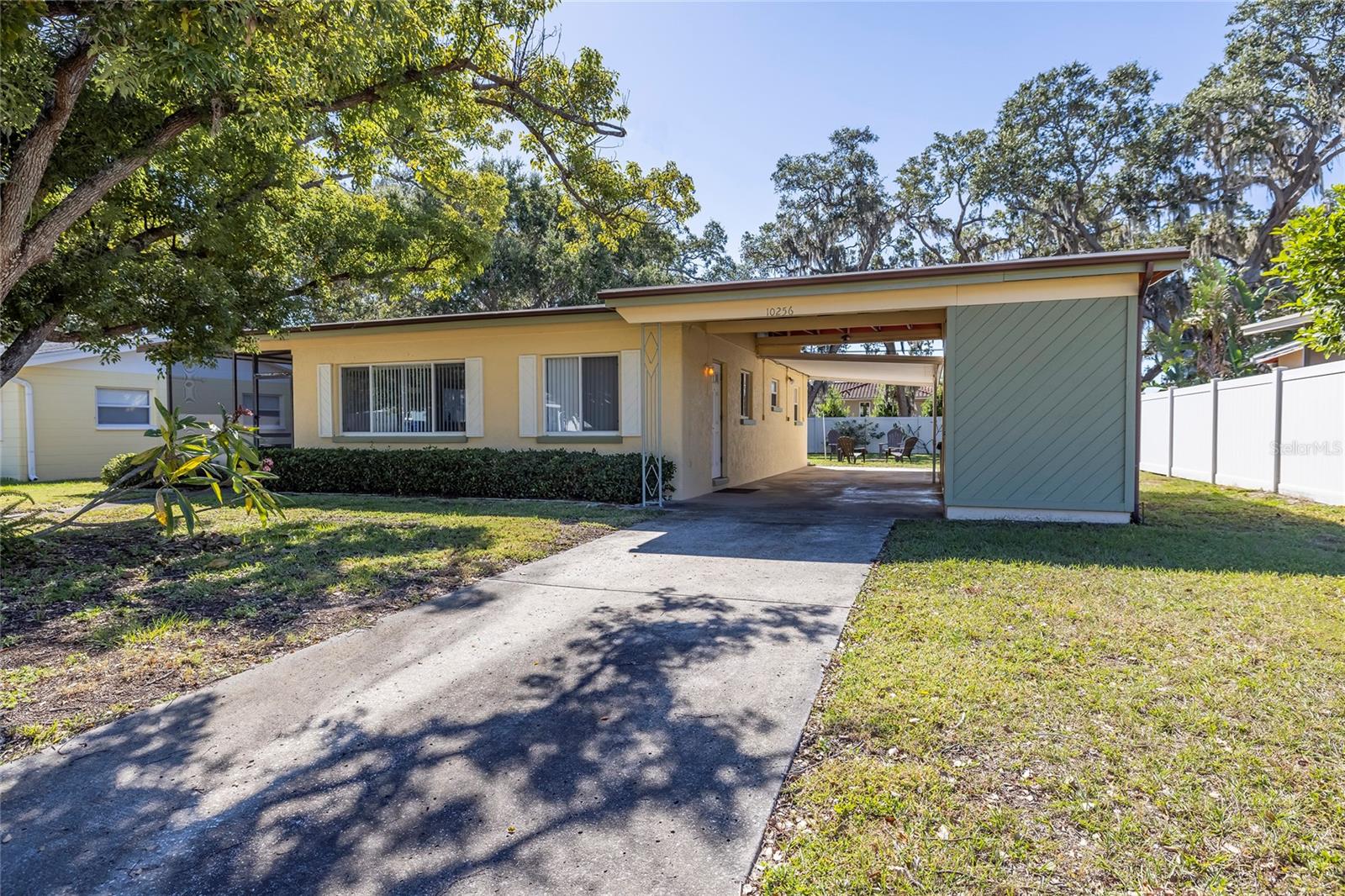 Over 1700 SQ of indoor & outdoor living in this block construction home just 2.5 miles to the Beautiful Gulf BEACHES located in flood zone X with a large back yard with room for a pool, screened patio, 2 car carport with laundry room & storage room.