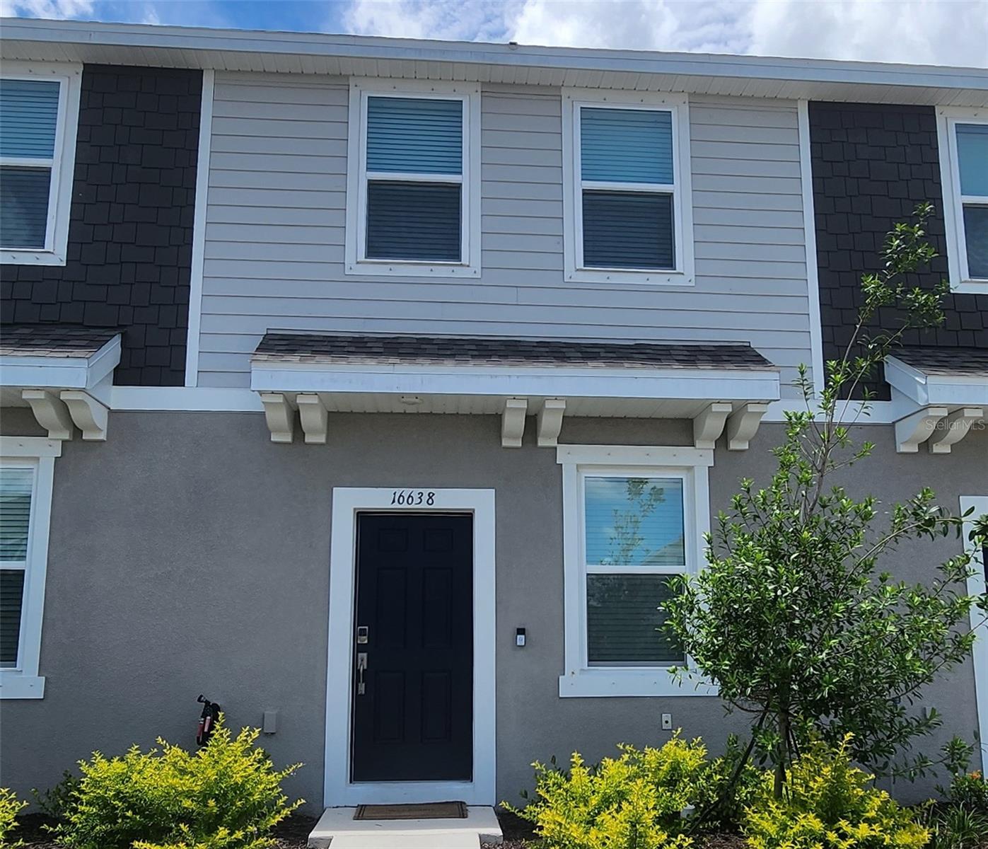 Step into comfort and style with this brand-new 2024-built townhome located in the desirable Townhomes at Azario. This cozy yet modern 2-bedroom, 2.5-bath home offers a thoughtfully designed layout perfect for everyday living and entertaining. Downstairs, enjoy an open-concept floorplan with a bright white kitchen featuring quartz countertops and plenty of cabinet space, flowing seamlessly into the living and dining areas. Sliding glass doors lead to a private outdoor patio—ideal for your morning coffee or evening wind-down. A convenient half bath on the main level is perfect for guests. This townhome is available furnished or unfurnished.
Upstairs, both bedrooms showcase an ensuite bathrooms for privacy and comfort. The spacious primary suite includes dual sinks and a sleek glass-enclosed shower, while the second bedroom features a shower/tub combo. The upstairs laundry room adds everyday ease. Assigned parking is included, and the community itself offers resort-style amenities including a sparkling pool with cabanas and a dog park for your furry friends. Warm, welcoming, and move-in ready—this townhome is the perfect place to call home.
