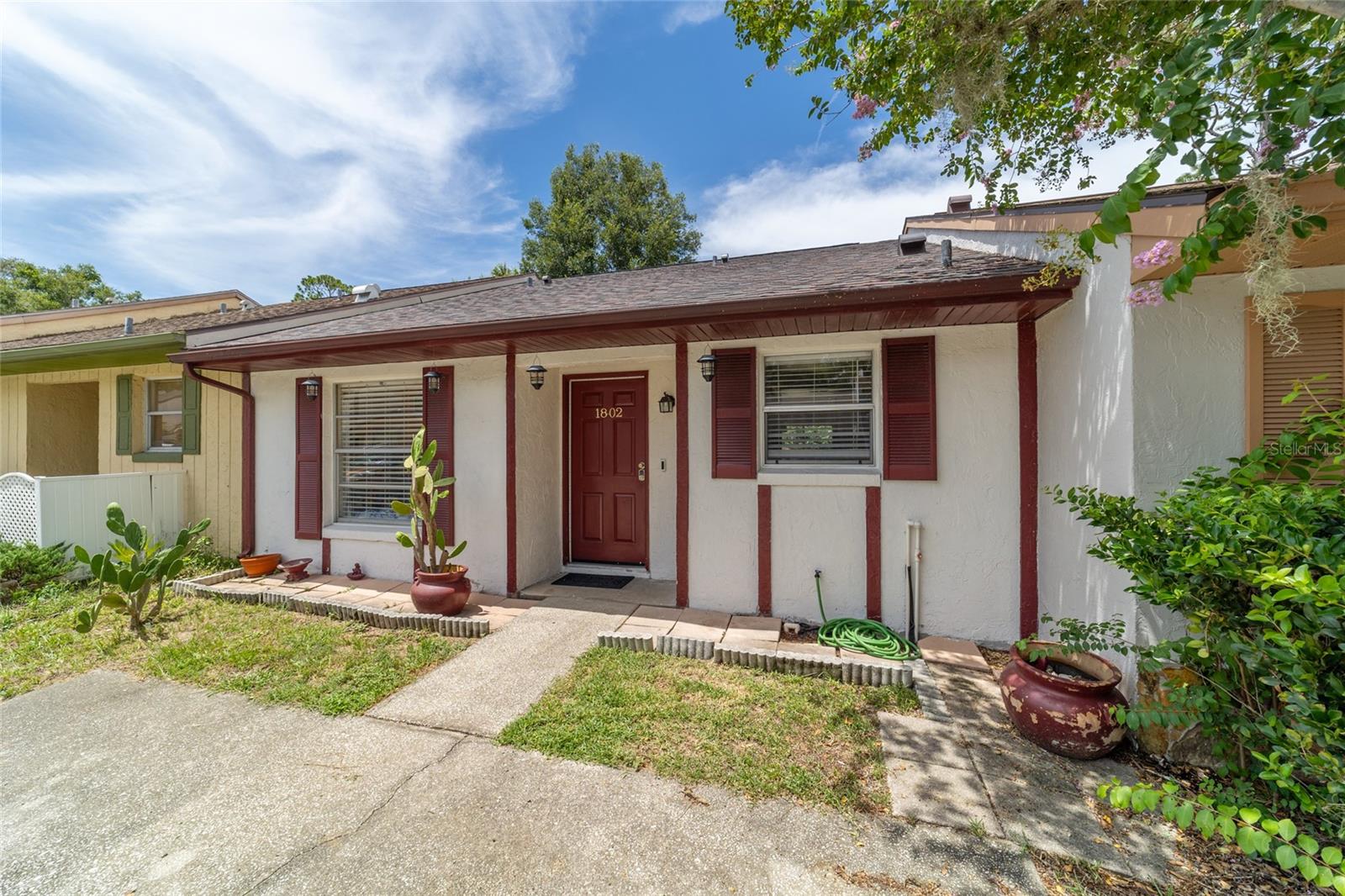 Welcome to this LIGHT AND BRIGHT TWO BEDROOM, TWO BATH WELL MAINTAINED HOME! The high ceilings, open floor plan and fresh paint are many of the features you are bound to love. There is NO CARPET IN THE HOUSE! THE ROOF WAS RECENTLY REPLACED AND THERE IS A NEWER TANKLESS HOT WATER HEATER! The SPACIOUS KITCHEN HAS ALL OF THE APPLIANCES YOU WILL NEED INCLUDING A DISHWASHER. The washer and dryer are newer too! Lots of room for fun in the BACKYARD! Fire up the grill and kick back outside on the patio. NO HOA FEES! This is a fantastic location. Take your BIKE OR WALK DOWN TO WHISPERING PINES PARK AND ENJOY THE TRAIL OR COOL OFF IN THE IN THE POOL. Your driveway parking is right at your front door!