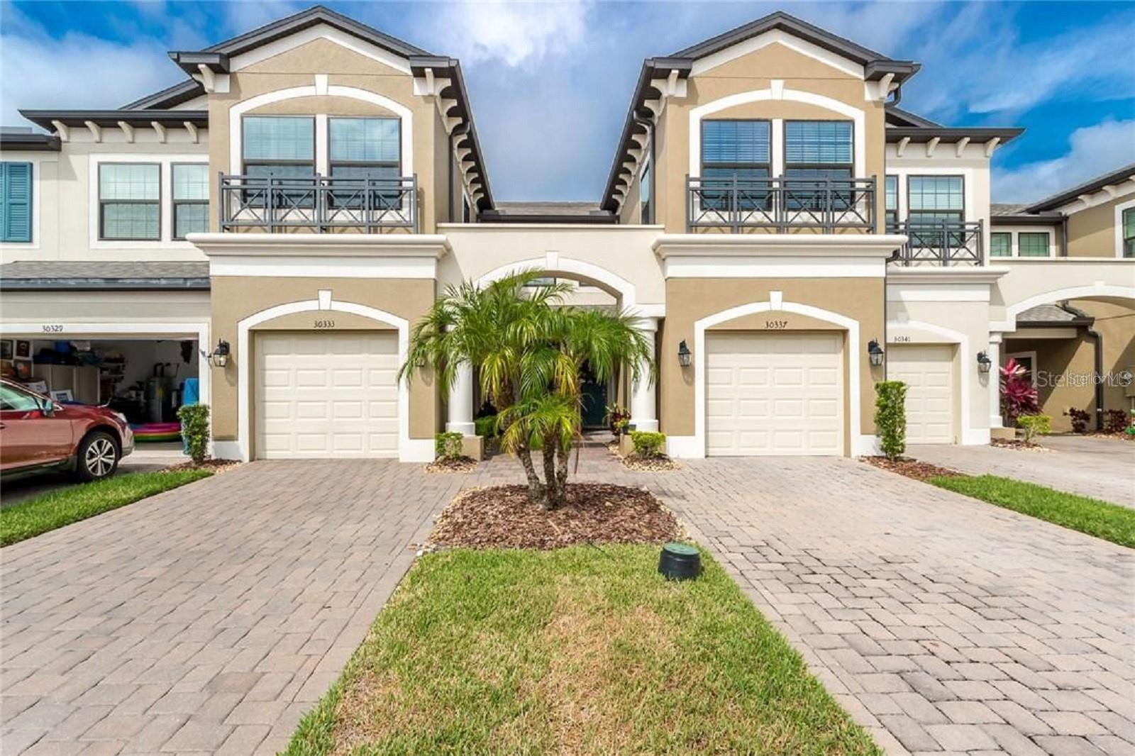 You couldn't ask for a better backyard! Walk out of the homes screen room and ten steps later is the community pool and immaculate water view! here is no need to renovate because pride of ownership is clearly shown the second you step into this beautiful Town home in the Newer Gated Community in Windermere Estates! This is as close to new construction as you're going to find! Very open concept downstairs. Ceramic tile all throughout the downstairs. The kitchen is in the back of the home and includes a very big walk in pantry closet, stainless steel appliances, like new wooden cabinets and granite counter top. Master bathroom comes with dual sinks and is located in the master bedroom. Split floor plan upstairs to offer privacy between master bedroom and other two bedrooms. Walk in the closets in the master bedroom and second bedroom. All three bedrooms are upstairs. All the exterior, pest control, pool maintenance, trash, water and lawn are included with the HOA. Come make this home yours today!