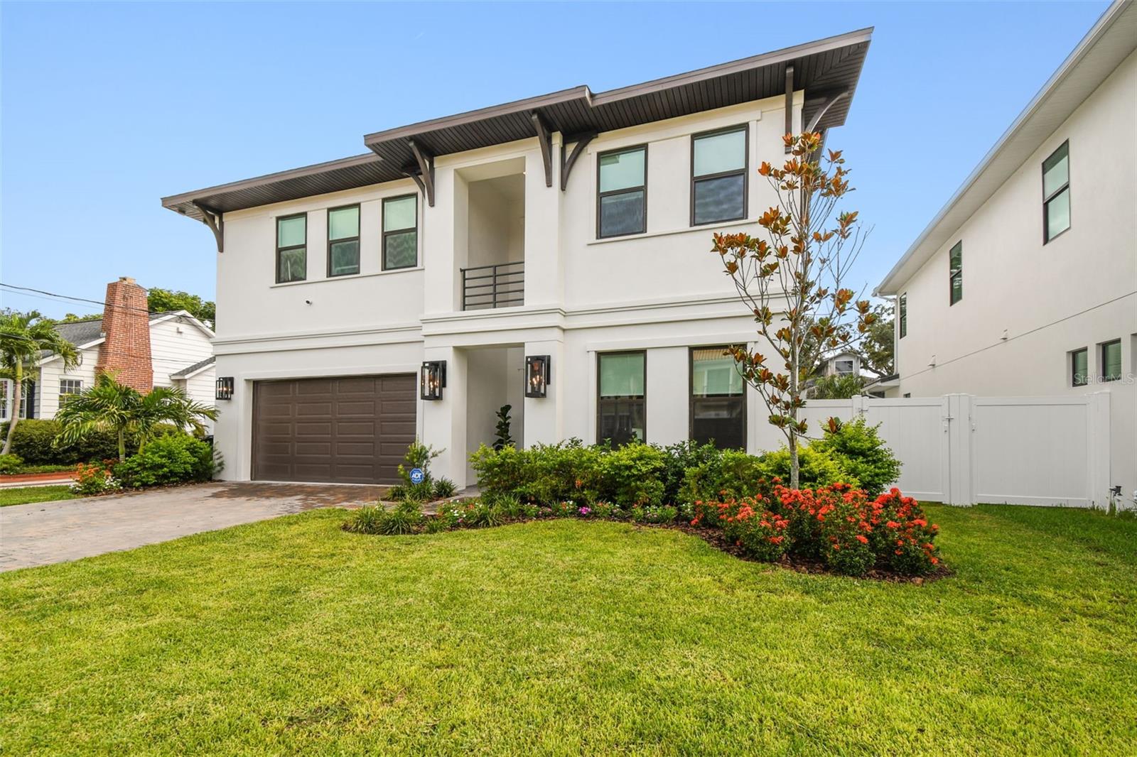 Discover this exquisite new custom-built home located in one of the most desired and quiet neighborhoods in South Tampa. Just walking distance from from the iconic Bayshore Boulevard. Boasting 5 spacious bedrooms, 4 full bathrooms, and a dedicated office, this residence is thoughtfully designed with high-end finishes and timeless elegance throughout. Step inside to find rich hardwood flooring, soaring ceilings, a custom-crafted stairwell, and windows framed with elegant 3.5" Delta Howe casing. The oversized kitchen is a chef’s dream, complete with 42" cabinetry, a custom butler’s pantry, and a spacious eat-in area. The open-concept layout flows effortlessly into the great room and formal dining space—perfect for entertaining. Sliding glass doors lead to a covered lanai and a fully fenced backyard, ideal for gatherings or quiet evenings outdoors.
The exterior features pavers on the driveway, front porch, and back lanai, creating a seamless blend of style and function. Additional highlights include custom built-out closets, a whole-house generator, designer window treatments, and many more premium upgrades.
A private downstairs bedroom with a full bath offers flexibility and could easily serve as a guest suite or pool bath. Upstairs is equally as impressive with a custom build in bench and open hallway. The luxurious owner’s retreat features a generously sized bedroom, two large walk-in closets, and a spa-like ensuite bath with a double vanity, an oversized standalone soaking tub, and a separate glass-enclosed shower. The secondary bedrooms are large and 2 of the bedrooms share a jack and jill bathroom with private vanities while the 4th upstairs bedroom has a private en suite bathroom. Enjoy the convenience of being within walking distance to Bayshore Boulevard, shopping, dining, the YMCA, and top-rated schools—Roosevelt, Coleman, and Plant. Quick drive to downtown and easy access to the Selmon Expressway, this home truly has it all. Call me today for your private tour.