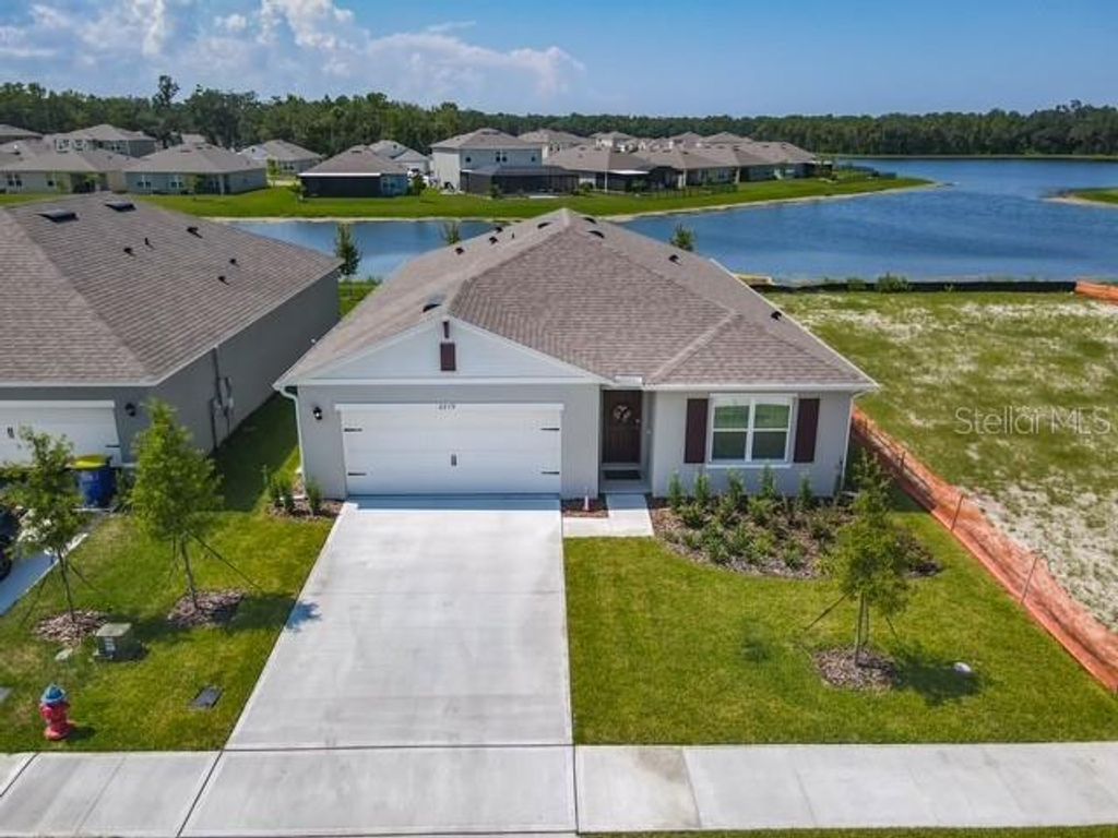 Photo of 2219 Lake Preserve Circle, New Smyrna Beach, FL 32168 (MLS # NS1086904)