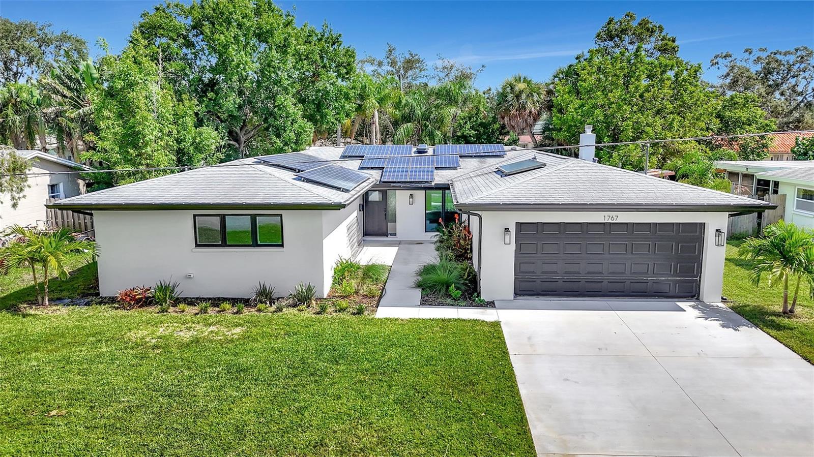 Your chance to call Shore Acres home — without the luxury price tag. Tucked into one of St. Pete’s most beloved neighborhoods, this spacious 4-bedroom, 2-bath POOL home is a rare opportunity to bring your design dreams to life. Just minutes from the energy of downtown St. Petersburg, community boat launches, a state-of-the-art rec center, The Pier, and world-famous beaches, you’ll be at the center of it all — while still enjoying the laid-back charm of Shore Acres living. Step inside and imagine the possibilities with this fully remediated open-concept floor plan, ready for your personal touch. The oversized primary retreat offers a peaceful escape with an en-suite bath and walk-in closet. Major updates are already taken care of, including paid-off solar panels (2017) keeping your electric bills impressively low, a brand-new driveway (2024), updated plumbing (2024), resurfaced pool, and hurricane impact windows. Beyond the home, Shore Acres offers a sense of community that’s hard to find — friendly waves from neighbors on morning bike rides, festive holiday golf cart and boat parades, and access to highly-rated Shore Acres Elementary plus nearby private school options. Whether you’re looking for your forever home or a smart investment, this is the blank canvas you’ve been waiting for. Schedule your private showing today and start envisioning the future you’ll build here.