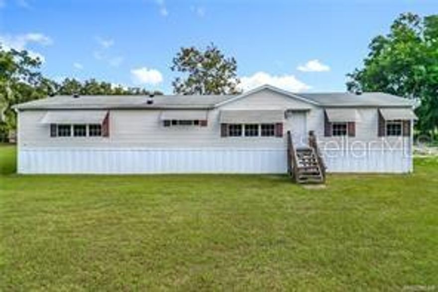 This well-maintained 3-bedroom, 2-bathroom home offers 1,792 sq. ft. of living space on a generous 0.93-acre lot, providing a peaceful setting just minutes from some of Florida’s most sought-after natural springs. Brand new LVP flooring throughout and brand new well. Inside, you'll find a large sitting room with a cozy fireplace, ideal for gatherings or quiet evenings at home. The layout is open and inviting, with abundant natural light and plenty of potential to personalize. Two separate living areas and a formal dining room as well. This home is not shy on space! Located just steps from Lake Rousseau, the property includes deeded access to a separate vacant lot for direct water access—perfect for fishing, boating, or kayaking. You'll also be within 10 minutes of the crystal-clear Rainbow River and a short drive to Crystal River, known for its charming waterfront restaurants, manatee tours, and annual festivals. Whether you're looking for a permanent residence, vacation home, or investment opportunity, this property offers a rare combination of space, location, and value. No HOA, no lot rent and NO flood zone!