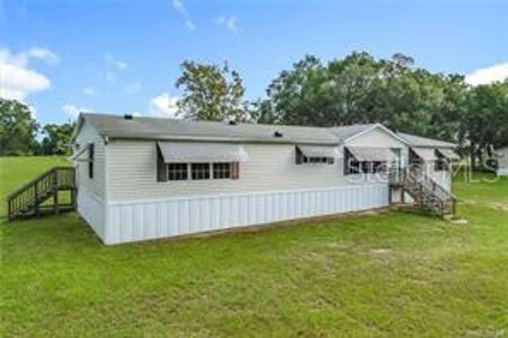 Photo of 11908 N Care Point, Dunnellon, FL 34433 (MLS # TB8488571)
