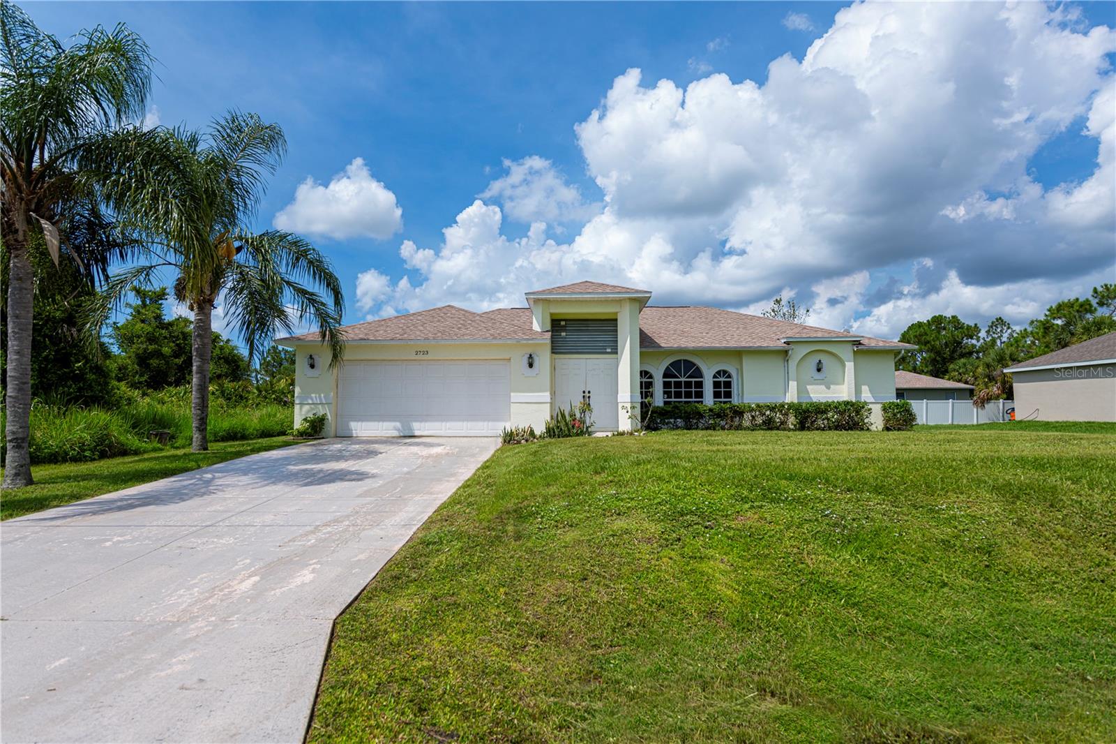 INVESTOR ALERT! Bring your finishing touches to this 3-bedroom, 2-bath, 2-car garage split plan home, built in 2005 and perfectly situated in an area of newer homes. Priced to sell, this property offers lots of curb appeal, showcasing a soaring entryway, double door entry, banded accents, and alcove trim. Step inside to a welcoming foyer that opens up to a spacious living room with vaulted ceilings, plant shelves, and sunburst windows that flood the space with natural light.
There’s a separate dining area conveniently adjacent to the kitchen, which offers backyard views, solid surface countertops, ample cabinetry, a pantry, and a breakfast bar. The large master suite features sliders to the patio, dual closets, and an ensuite bathroom with dual sinks, a private water closet, and a separate shower. Both guest bedrooms offer ample closet space and ceiling fans, just waiting for your finishing touches.
There’s plenty of room for a pool, and there’s already a pool bath in place—a rare find! With no HOA fees and a location safely outside the flood zone, this home has been a rental for several years and holds great potential as a year-round residence, seasonal getaway, or a smart income opportunity. Additional highlights include privacy-tinted pocket sliders opening onto a large screened lanai, a newer A/C, and a two-year-old roof, providing extra peace of mind and value.
Enjoy easy access to North Port’s many amenities, including Myakka State Park, Myakkahatchee Creek Environmental Center, miles of beautiful trails, horseback riding, hiking, bird watching, biking, water views, and access. The home is close to Punta Gorda Airport, dining, shopping, stadiums, beaches, Warm Mineral Springs, and the North Port Aquatic Center. Don’t miss the chance to make this home your own or add it to your investment portfolio!