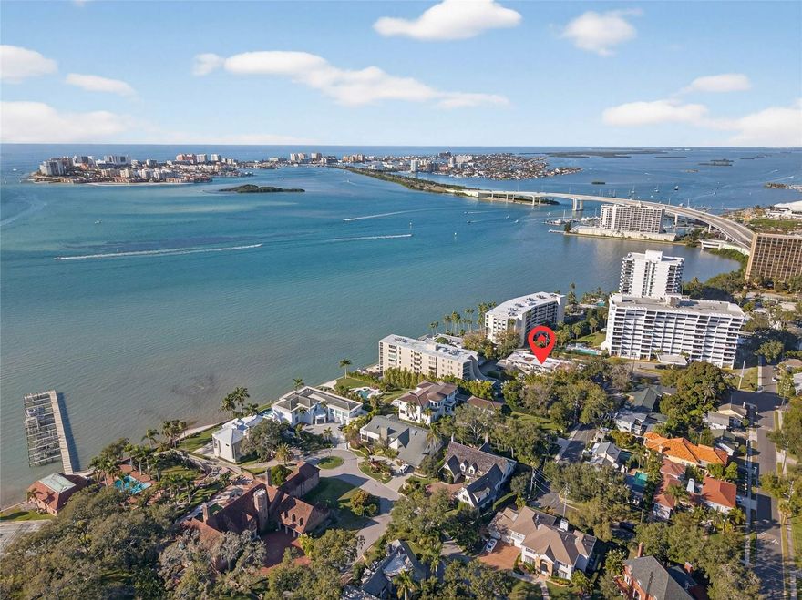 Rarely available and ideally positioned, this elevated, townhouse-style condo residence offers a refined Downtown Clearwater lifestyle within a waterfront community... and without the flood concerns! Situated at a high elevation, this end unit sits closest to the water and delivers a rare blend of coastal access, privacy, and peace of mind. The thoughtfully designed multi-level floor plan features an attached garage beneath the residence and multiple private outdoor patios, creating a seamless connection between indoor and outdoor living. Each spacious bedroom is complemented by its own private bathroom, offering a level of comfort and separation. The interior has been tastefully updated with attention to detail and has been meticulously maintained. The building roof was replaced in 2021, reinforcing long-term quality and value. Residents enjoy access to a waterfront pool, a dock just steps from your front door, and an exceptional walkable lifestyle- just moments from Coachman Park, local coffee shops, dining, and downtown events, with Clearwater Beach just a short ride over the bridge. Designed for flexibility and ease, this residence is equally suited as a primary home, seasonal retreat, or strategic investment opportunity. Monthly HOA dues include a comprehensive range of services, supporting effortless, "lock-and-leave" living in one of Clearwater’s most desirable waterfront settings. A rare offering where location, lifestyle, and elevation converge. This is one home you won't want to miss!