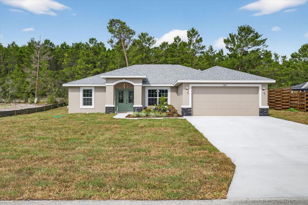 Photo of 6005 Moongate Road, Spring Hill, FL 34606 (MLS # TB8428973)