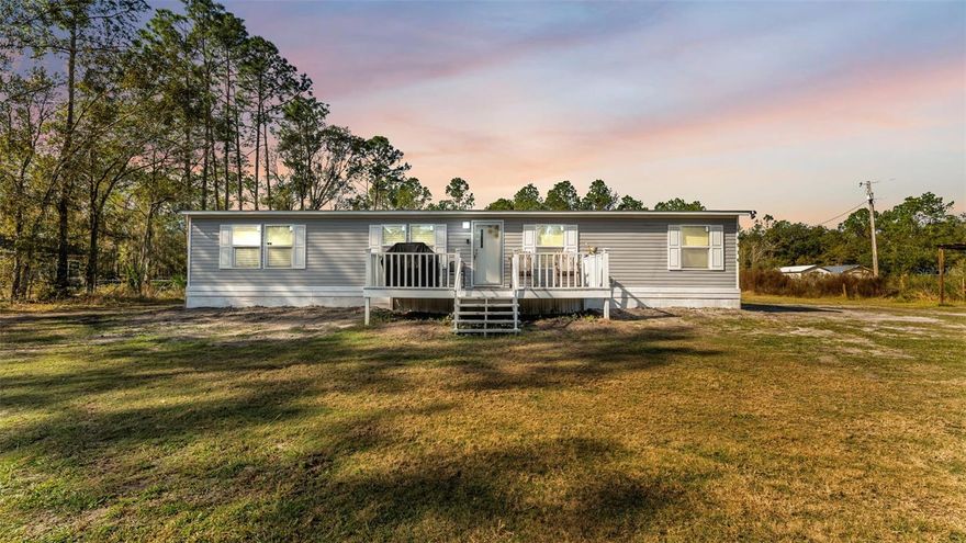 Tucked away in North Lakeland and set well off the main road, this charming manufactured home offers privacy, space, and room to grow. Featuring a desirable split floor plan, the home includes 4 bedrooms, 2 bathrooms, and over 1,400 square feet of thoughtfully designed living space. Situated just under 2 acres, the property provides ample room for outdoor enjoyment with plenty of space for children to play, as well as room for sheds, tractors, and additional storage. The spacious kitchen features an island and opens seamlessly to the living and dining areas, creating a functional and inviting layout. The primary bedroom is generously sized with its own private bathroom and ample closet space. A separate laundry room adds convenience, and the long driveway enhances privacy and accessibility. If you’re looking for a home with land, privacy, and usable space both inside and out, this North Lakeland property is a must-see.