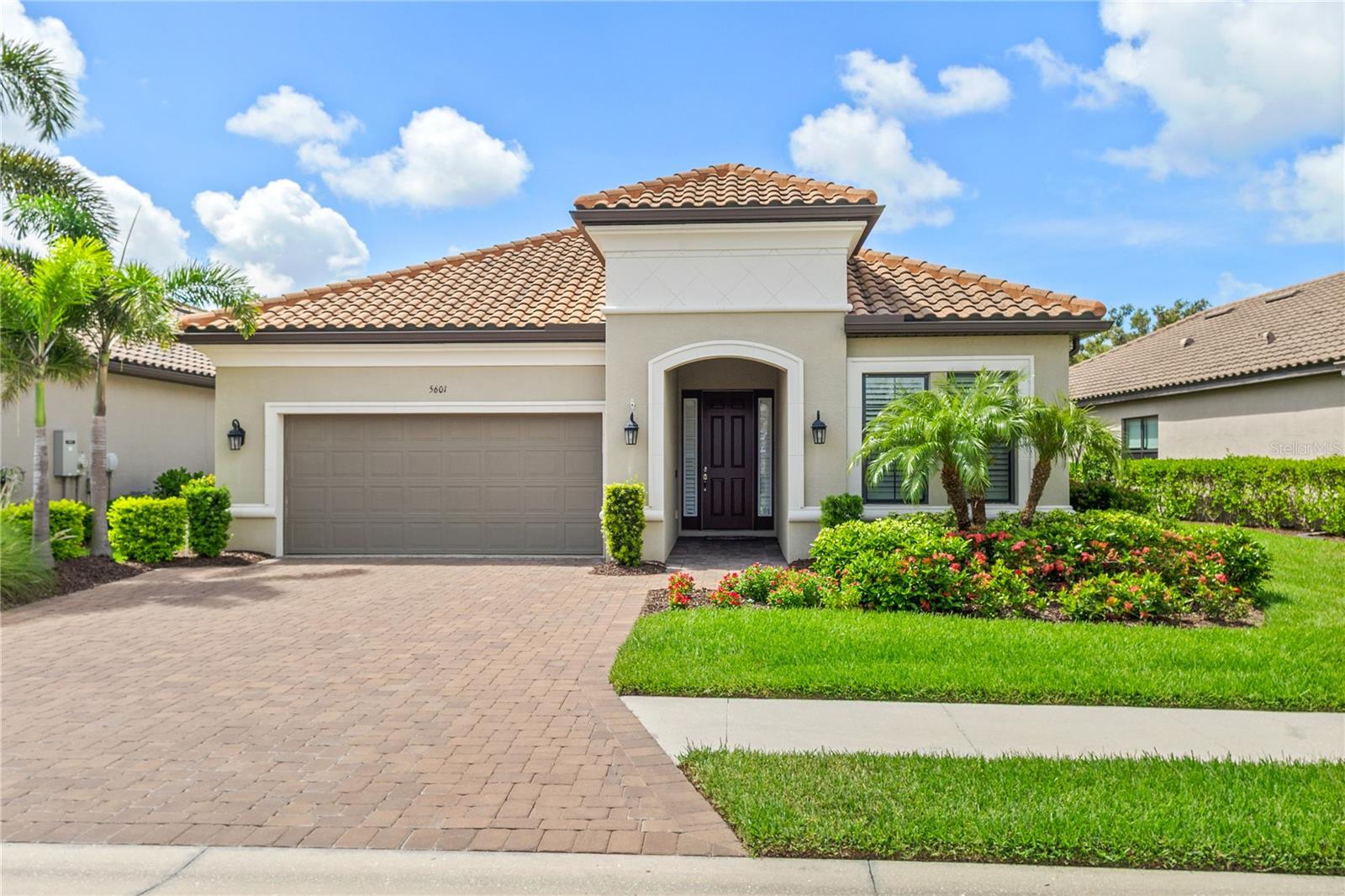 Experience luxury living in this exquisite home nestled within the gated community of Bellacina by Casey Key. Boasting private preserve views from your spacious lanai that can be entered through the large opening created by unique telescoping sliding doors that lead to the lovely outdoor space complete with a gas fireplace, space to sit and relax, an outdoor kitchen and private pool. The residence also includes plantation shutters on windows offering a perfect blend of elegance and privacy while all floors have wood-look tile. The desirable and rarely available Santini floor plan is thoughtfully laid out to provide large open spaces for living and entertaining guests. Notable upgrades in this plan include a coffee bar adjacent to the kitchen and “drop zone” as you enter the home from the garage. The gourmet kitchen has abundant cabinetry, a large walk-in pantry and an expansive preparation island ideal for gracious entertaining. The primary bedroom is spacious with a spa-like bath with designer features and a custom closet that has direct access to the laundry room and, there is hurricane protection on all openings. Bellacina by Casey Key offers gated resort-style living with its spacious pool and spa, state-of-the-art fitness center within the community clubhouse that also features meeting spaces, a billards room and social gathering choices. Just beyond the clubhouse are tennis, pickle ball and bocce ball courts and direct access to the scenic Legacy trail. This exquisite home is in an ideal location that offers privacy yet is convenient to beaches, shopping, restaurants and more.