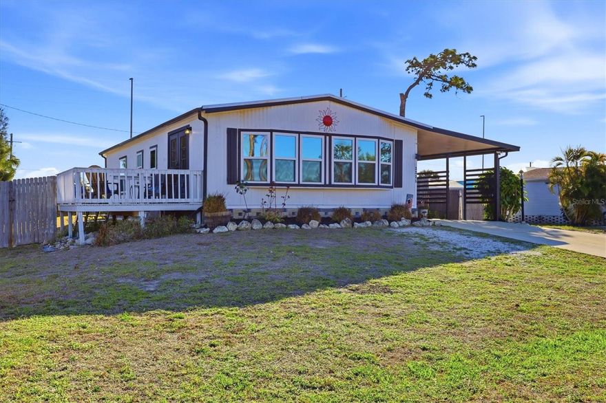 Enjoy relaxed coastal living in this 2-bedroom, 2-bath home with a family room, located just 0.3 miles from Lemon Bay and ideally positioned near the Stump Pass boat ramp and minutes from Manasota Key beaches and Historic Dearborn Street. Thoughtfully remodeled, this home features engineered hardwood flooring throughout, a spacious kitchen with pantry, granite countertops, stainless steel appliances, breakfast area, and a dining room with coffee bar that opens to the main living space for easy entertaining. French doors lead to a sundeck, perfect for Florida outdoor living and entertaining while enjoying the sunshine. The primary suite offers a walk-in closet and an ensuite bath with separate shower and vanity area, while the guest bedroom also features a walk-in closet and a nearby full bath. Additional storage includes a linen closet and a spacious laundry room. This home also includes a generator for peace of mind and experienced no damage in recent storms. Additional highlights include a newer roof and A/C, both replaced in 2019, a hot water heater replaced in 2021, an 8x8 shed for beach or boating gear, partially fenced yard, space for boat parking, public water and sewer, and no HOA or deed restrictions. Whether you're looking for a full-time residence, seasonal getaway, or affordable coastal retreat, this property offers comfort, convenience, and easy access to boating, beaches, shopping, dining, and the weekly farmer’s market.