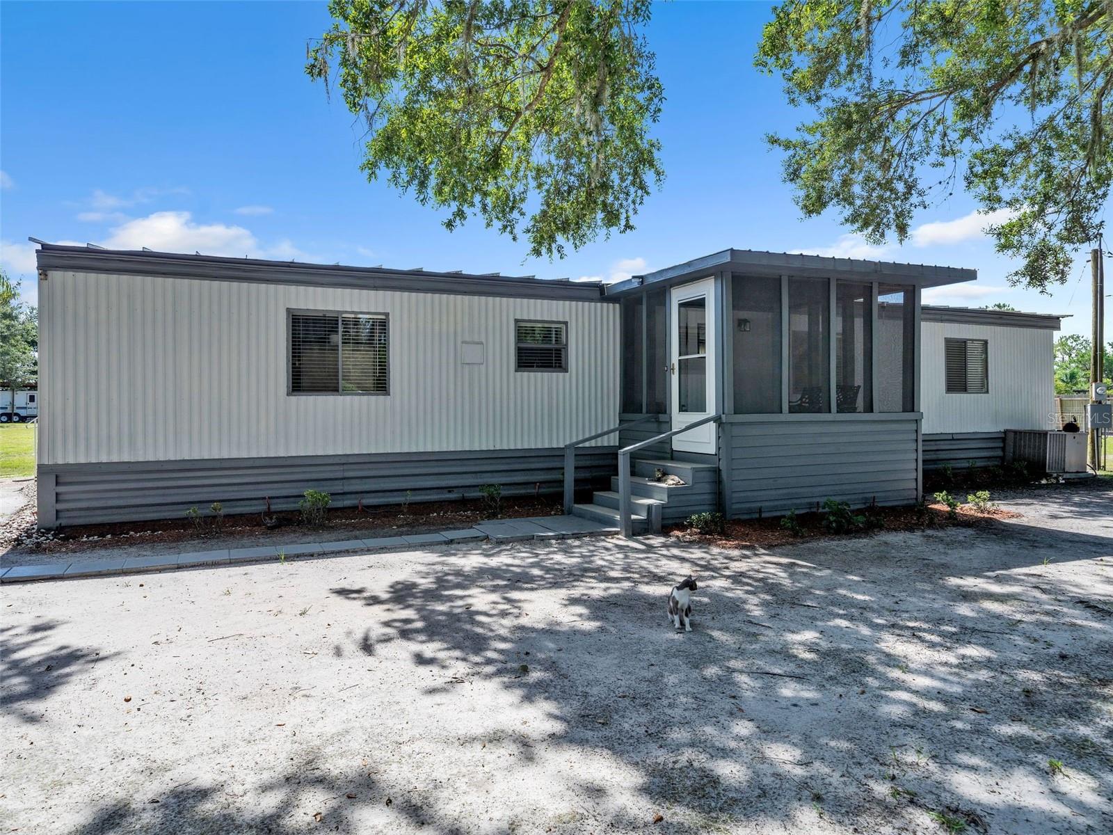 Escape the hustle and settle into peace and privacy! This beautifully renovated 2-bedroom, 2-bathroom single wide manufactured home is move-in ready and waiting for its new owner. Nestled on a 1.16-acre lot, this property offers the perfect blend of tranquility and convenience.
Whether you're looking for a quiet retirement retreat, your very own homestead on a budget, or a weekend getaway surrounded by nature, this one check all the boxes including 4 outbuildings ready for your workshop space, craft room or storage for your toys. Enjoy open skies, room to grow, a back and frontal yard completely fenced-in and the calming atmosphere of rural living, all while being just a short drive to the heart of Lake Wales and nearby natural attractions.