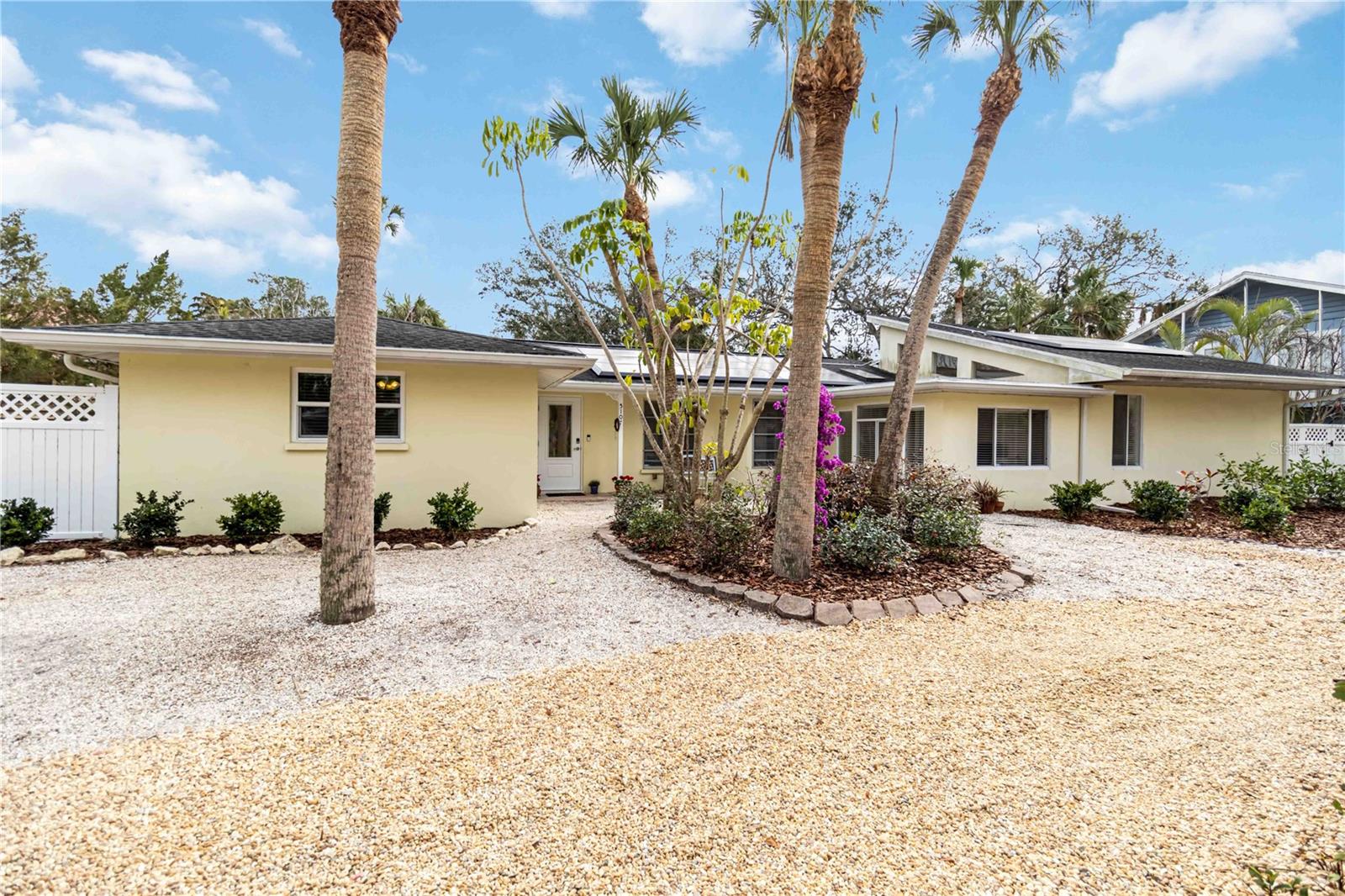 One or more photo(s) has been virtually staged. **Seller Financing and Seller-Paid Rate Buy Down Available** Welcome to 5107 Saint Albans Avenue, Sarasota, Florida 34242 – a beautifully reimagined home on one of Siesta Key's most sought-after streets. This exceptional 3-bedroom, 2.5-bathroom ranch home, plus den, has been meticulously updated and nearly rebuilt with every modern convenience in mind. Situated on a large, tree-canopied lot with a quiet, county-protected street, this property offers both tranquility and privacy, while being within walking or biking distance to the world-famous Siesta Village and Siesta Beach.
As you approach this home, you are welcomed by the lush, established landscaping and canopy road, ensuring both beauty and peacefulness. The interior features an open, airy floor plan with soaring volume ceilings, skylights, and the gleaming restoration of original terrazzo flooring, adding timeless elegance. The home is equipped with new impact-resistant doors and custom-built closets, ensuring both style and security.
The heart of the home is the gourmet kitchen, complete with high-end stainless steel appliances, soft-close cabinetry, quartz countertops, and a spacious island. Perfect for entertaining or family meals, this kitchen seamlessly flows into the living areas, providing a modern and functional layout.
The large master suite offers a private retreat, with an impressive en-suite bath featuring a double vanity, oversized tub, and a separate frameless glass rain shower. The guest bath is equally stunning. All bathrooms are fully updated with top-quality materials and finishes.
Step outside to your backyard oasis, complete with an open-air pool, perfect for year-round relaxation and enjoyment. A brand-new pool pump ensures optimal performance and efficiency. The entire backyard is enclosed by a privacy fence, offering an intimate space for lounging or entertaining guests. The large lot also features a separate side yard, perfect for outdoor activities and recreation, already equipped with multiple climbing and swinging ropes. The oversized two-car garage provides additional storage space, and the brand-new landscaping further enhances the outdoor experience.
This home is packed with energy-efficient features, including a 2024 Tesla Solar system with 2 Powerwalls, a brand-new water heater, and two HVAC systems with three zones, offering exceptional climate control.
Beyond the home’s impressive features, the location is truly one of a kind. Living here means you can stroll or bike to Siesta Village and Siesta Beach, enjoying the local shops, bistros, and, most importantly, you’ll enjoy easy access to the pier and a quieter, more private beach experience – a world away from the traffic and crowds of the public beach and north and south bridges. This neighborhood offers a lifestyle that many only dream of, with easy access to everything on Siesta Key, without having to jump in your vehicle.
Additional features include a transferable low flood insurance policy and proximity to top-rated Phillippi and Brookside schools, which have world-renowned IB programs.
Don’t miss your chance to own this meticulously restored and updated gem in one of the most coveted areas of Siesta Key. Schedule your private tour today!