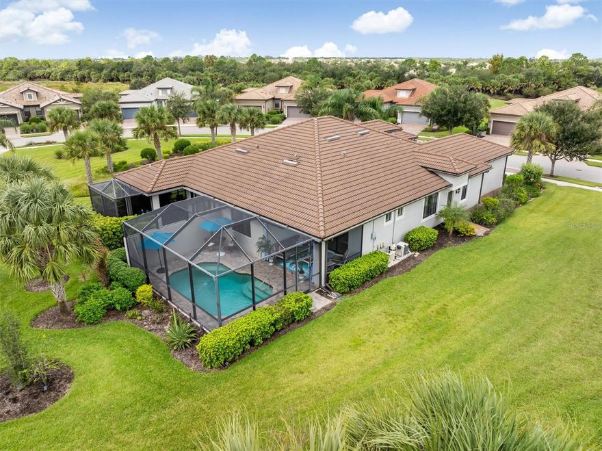 Experience the ultimate in Florida living at 12261 Marsh Pointe Road, a beautifully appointed 2-bedroom, 2-bath villawith a den in the highly sought-after Hammock Preserve on Palmer Ranch. This thoughtfully designed home stands out as one of the few villas in the community featuring its own private heated pool — offering the perfect blend of privacy, luxury, and low-maintenance living.
Step inside to an inviting open-concept floor plan filled with natural light and elegant finishes. The gourmet kitchen boasts quartz countertops, stainless steel appliances, a large peninsula with plenty of seating, and an abundance of cabinetry — ideal for both everyday living and entertaining. The spacious great room flows seamlessly to the screened lanai and pool area, creating a true indoor-outdoor oasis.
The primary suite features a walk-in closet and a spa-like en suite bath with dual vanities and a glass-enclosed shower. A comfortable guest bedroom, separate den or office, and a two-car garage complete the thoughtful layout. Outside, enjoy serene lake views and gentle breezes from your private screened pool and lanai — perfect for morning coffee,  watching the evening sky turn shades of pink, red and orange, or a relaxing swim year-round. Residents of Hammock Preserve enjoy resort-style amenities, including a community pool, fitness center, pickleball and tennis courts, clubhouse, and social activities — all within a gated, maintenance-free neighborhood. Ideally located in Palmer Ranch, you’re just minutes from Siesta Key Beach, Legacy Trail, shopping, dining, and all the best of Sarasota living. 12261 Marsh Pointe Road offers the rare opportunity to enjoy villa living without sacrificing the privacy of your own pool — a true hidden gem in Hammock Preserve.