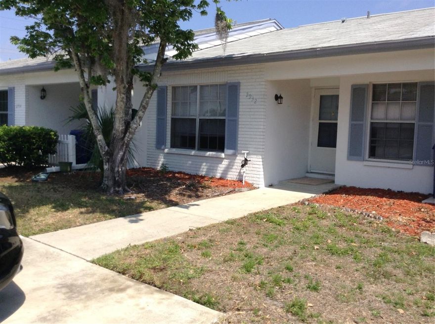 Beautiful 2/1 Villa in the popular Veterans Villas! Unfurnished annual rental, AVAILABLE APPROX. FEBRUARY 6TH 2026 FOR MOVE IN. This 2/1 villa may be just what you have been looking for!  Updated and in a great Trinity location.  Washer and Dryer hook ups inside the unit. Exterior pest control and lawn maintenance included.